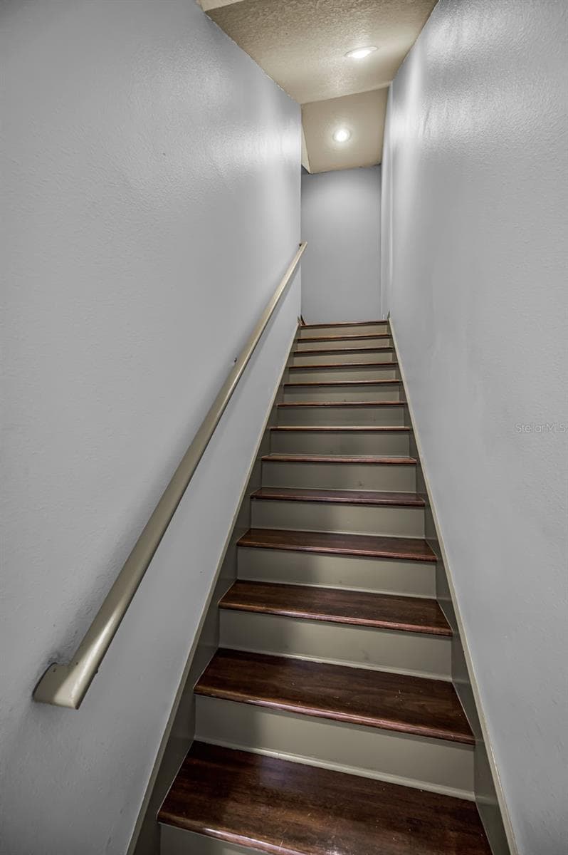 Stairs leading to Bonus Room on 2nd level - 4084 LIGUSTRUM DR, PALM HARBOR