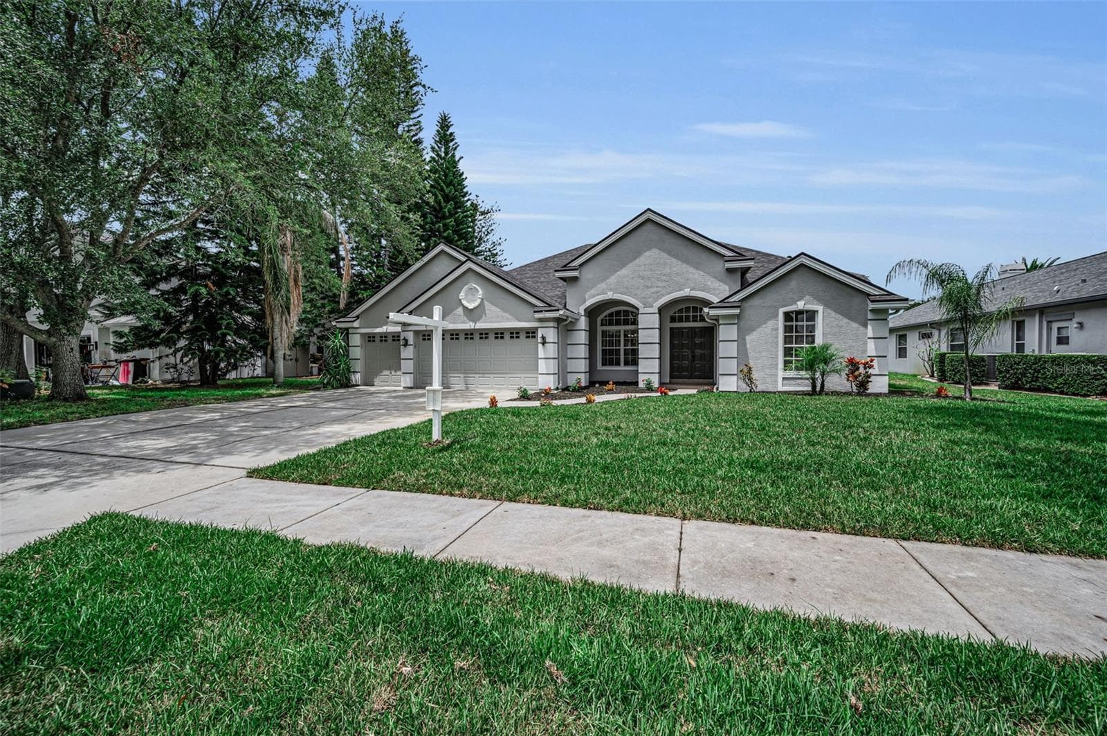 Front w/new sod - 4084 LIGUSTRUM DR, PALM HARBOR