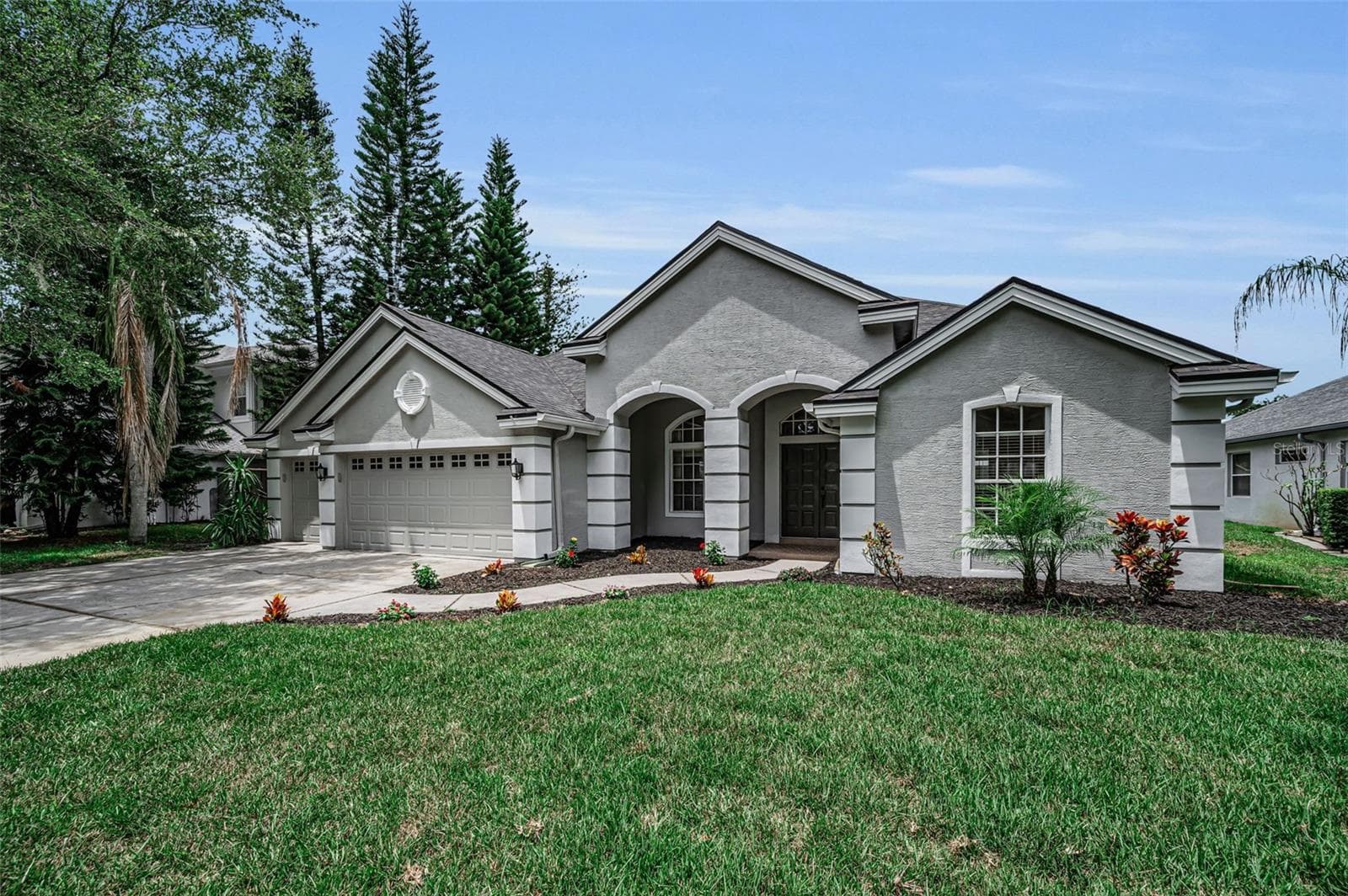 Front w/new sod - 4084 LIGUSTRUM DR, PALM HARBOR