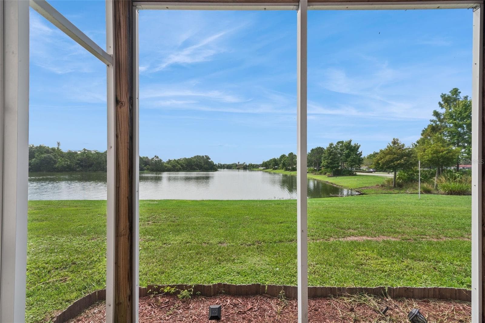 First Floor Covered Patio with view to the pond - 214 MAJORS LN #C, KISSIMMEE