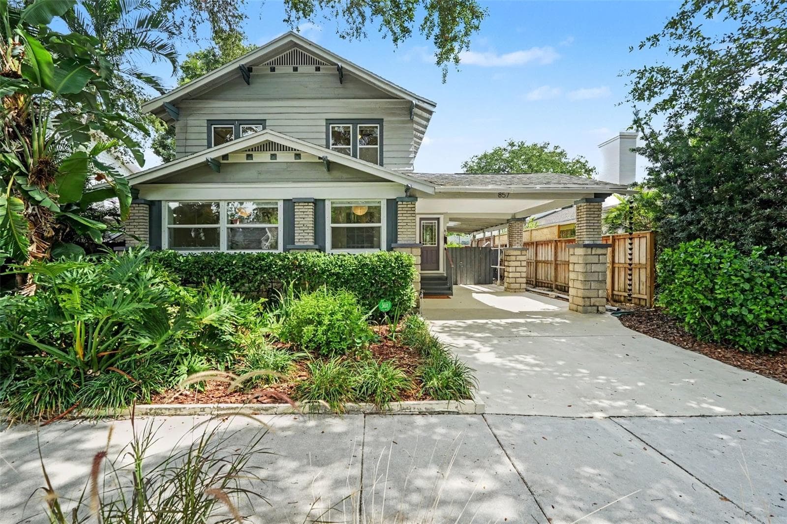 Set beneath a canopy of mature trees, this character-filled home blends historic charm with thoughtful modern updates. - 857 21ST AVE N, ST PETERSBURG