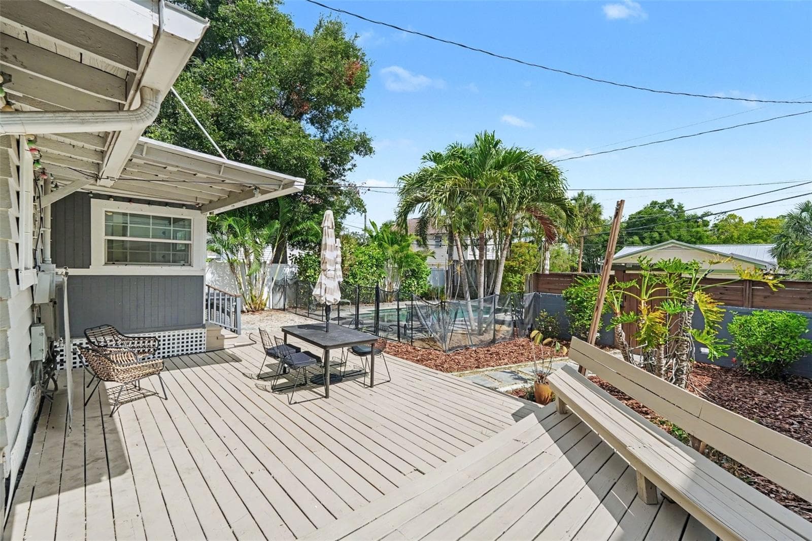 Step outside to a spacious deck with room for outdoor dining, lounging, and entertaining beneath the Florida sunshine. - 857 21ST AVE N, ST PETERSBURG