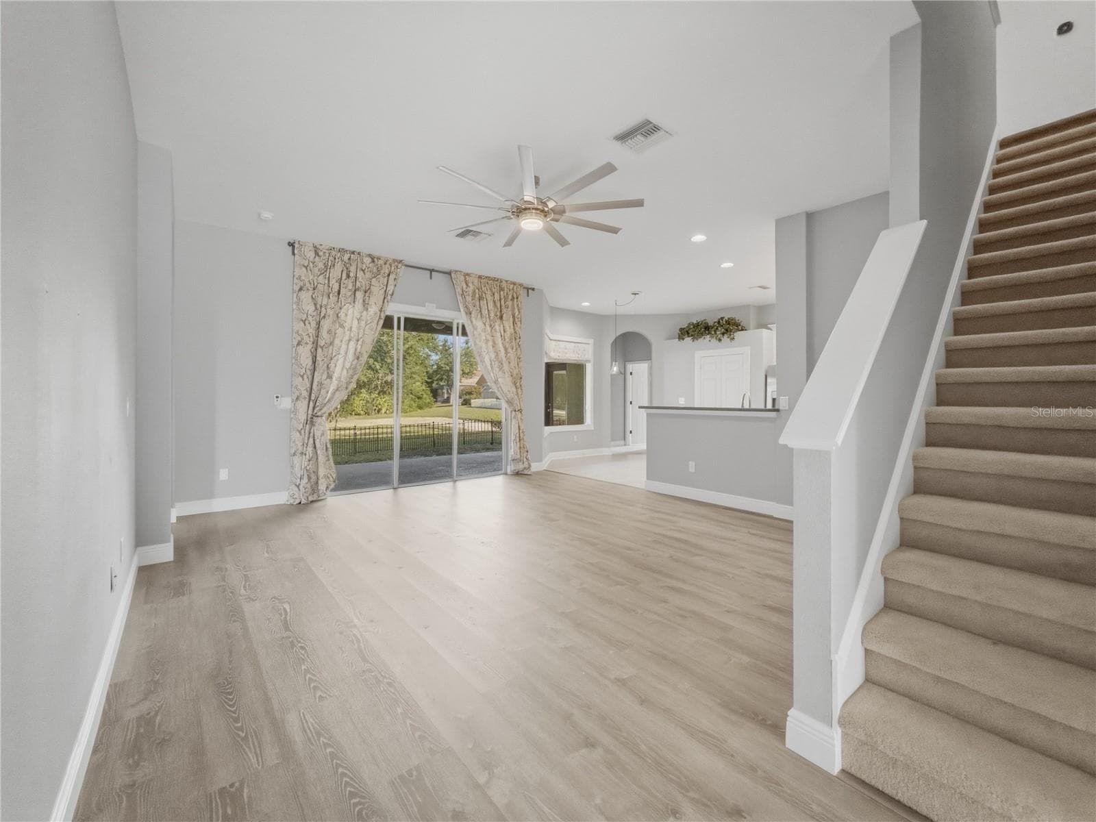 Family Room + Stairs - 11530 Oyster Bay Circle, New Port Richey, FL 34654 - 11530 OYSTER BAY CIR, NEW PORT RICHEY