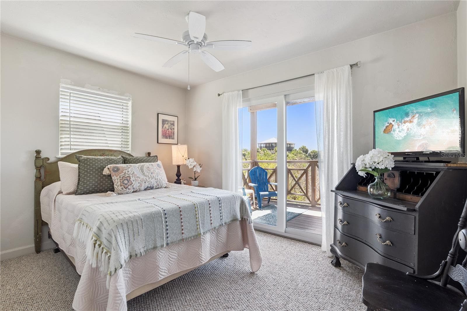 Bedroom with waterfront views and deck. - 884 CATFISH AVE, NEW SMYRNA BEACH