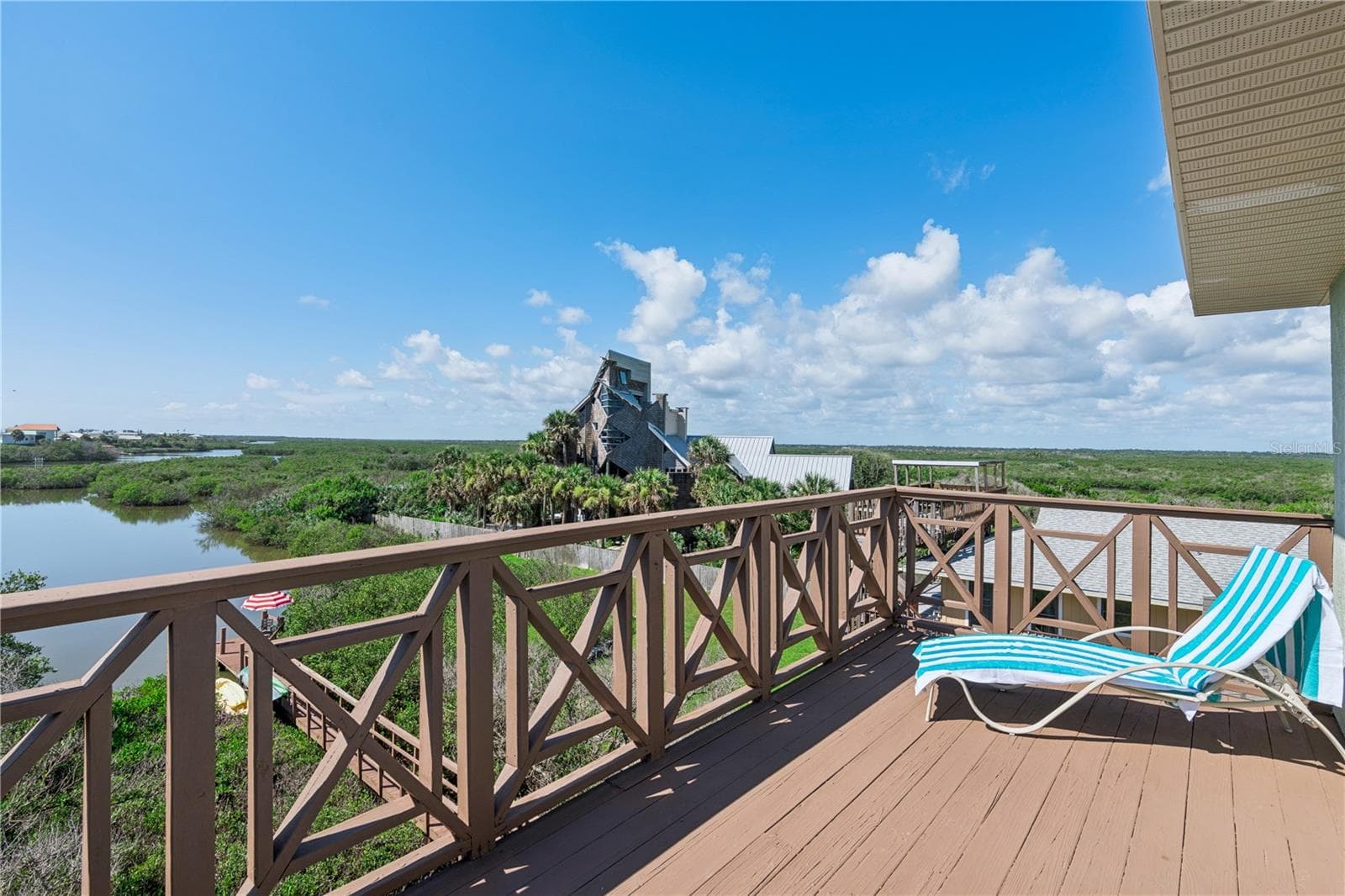 Open deck off primary suite southwest view. - 884 CATFISH AVE, NEW SMYRNA BEACH