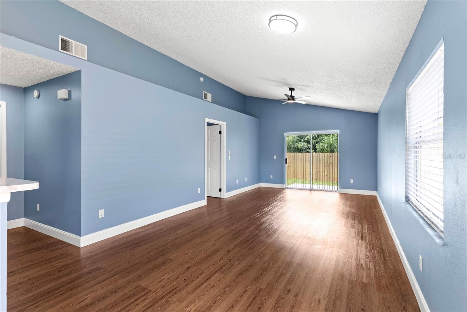 Living room and dining area - 5459 SEEDLING LN, ORLANDO