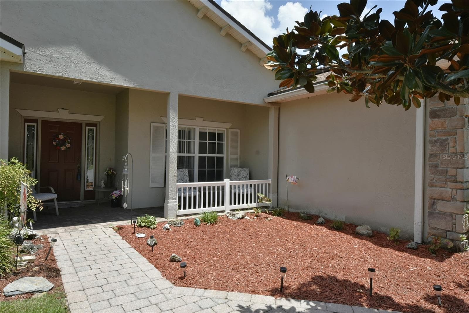 The covered front porch is a great place to enjoy the famous Florida weather. - 4360 ASHTON CLUB DR, LAKE WALES