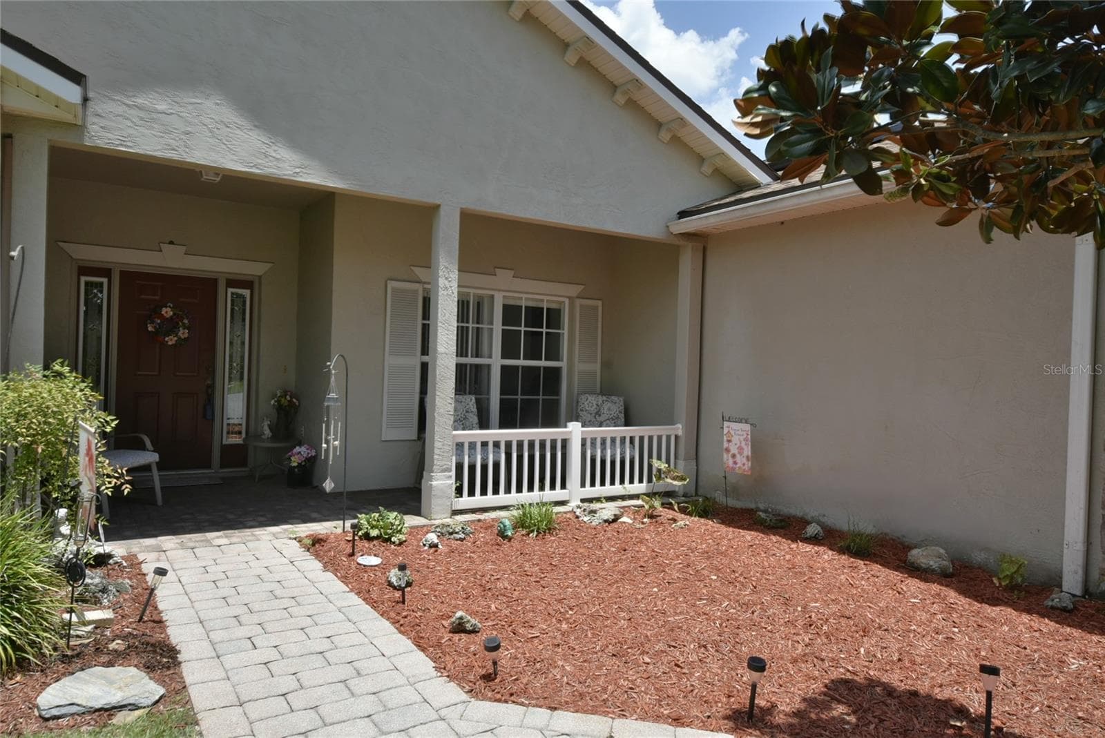 The covered front entry and porch. - 4360 ASHTON CLUB DR, LAKE WALES
