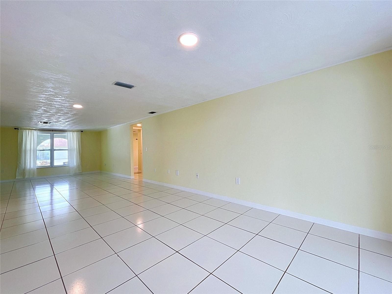 Dining room looking towards front living room/hallway to bedrooms - 7401 ISLANDER LN, HUDSON