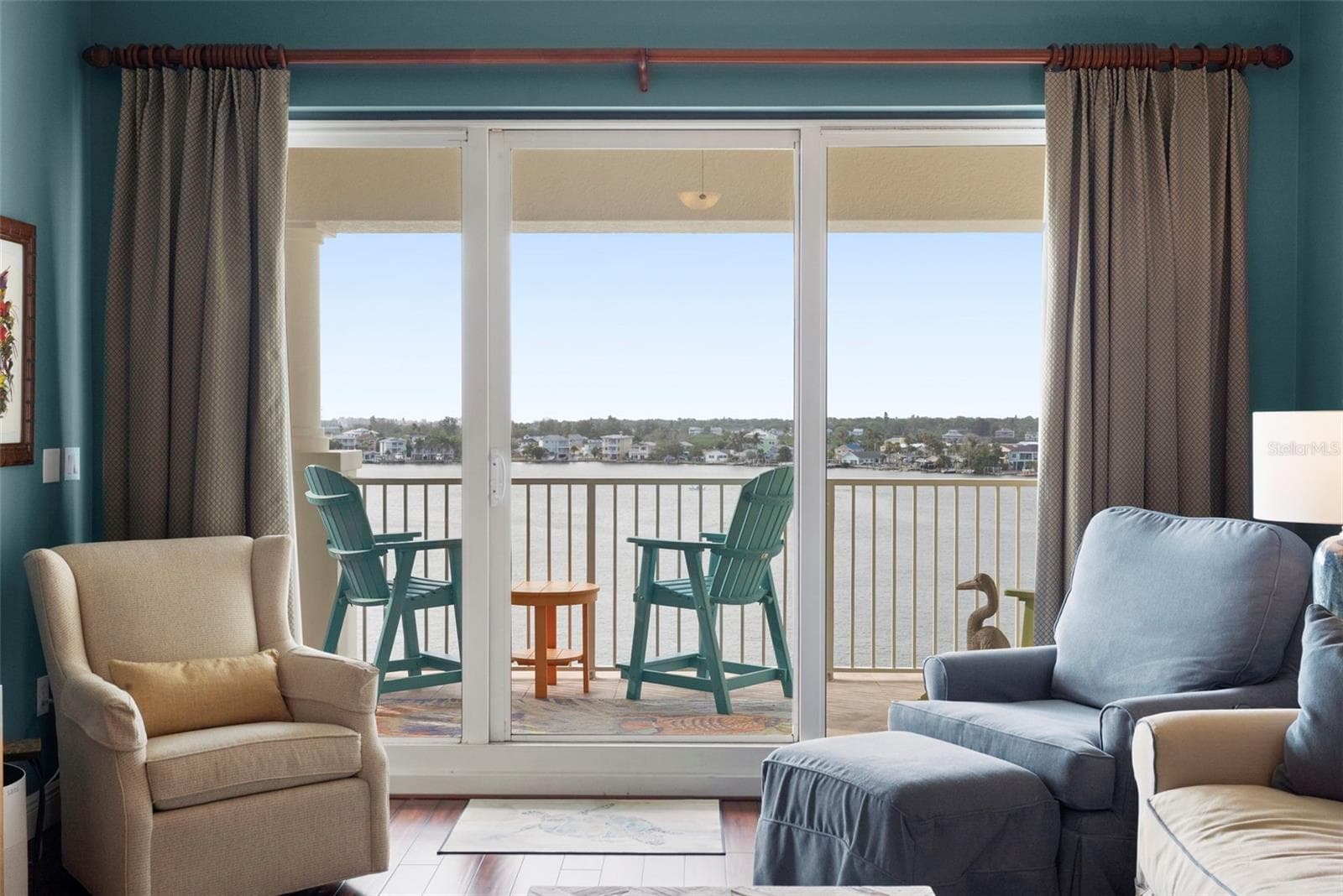 Living Room 12 x 8 Sliders lead to a huge 240 square square-foot balcony from the sixth floor with views all the way to the Gulf of Mexico - 17717 GULF BLVD #604, REDINGTON SHORES