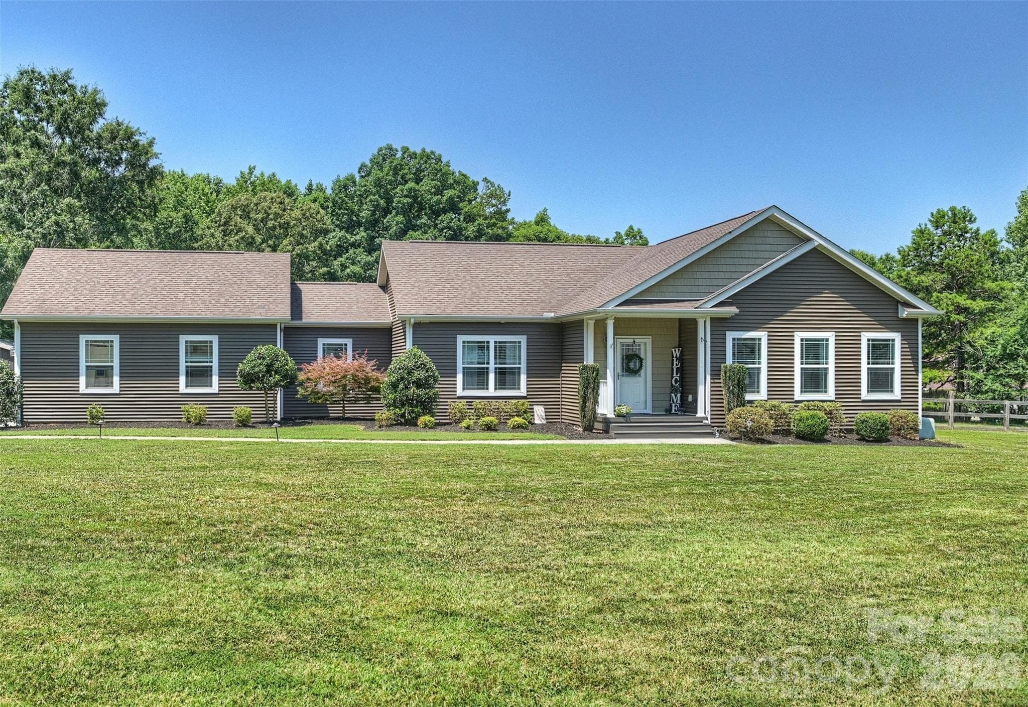 Welcome Home: Large 2.38 acre backyard and extended covered parking area and attached garage, Pergola outdoor living space, deck and patio area - 10943 Harrisburg Road, Indian Land