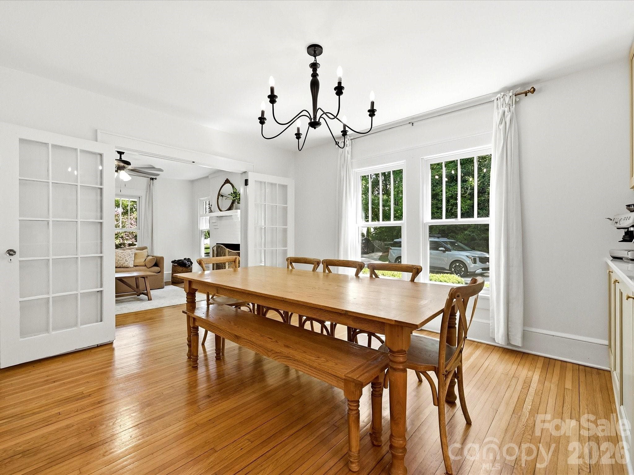 French doors connect the formal dining room to the main living area, creating a flexible layout ideal for both entertaining and everyday living. - 3514 Kelly Road, Charlotte