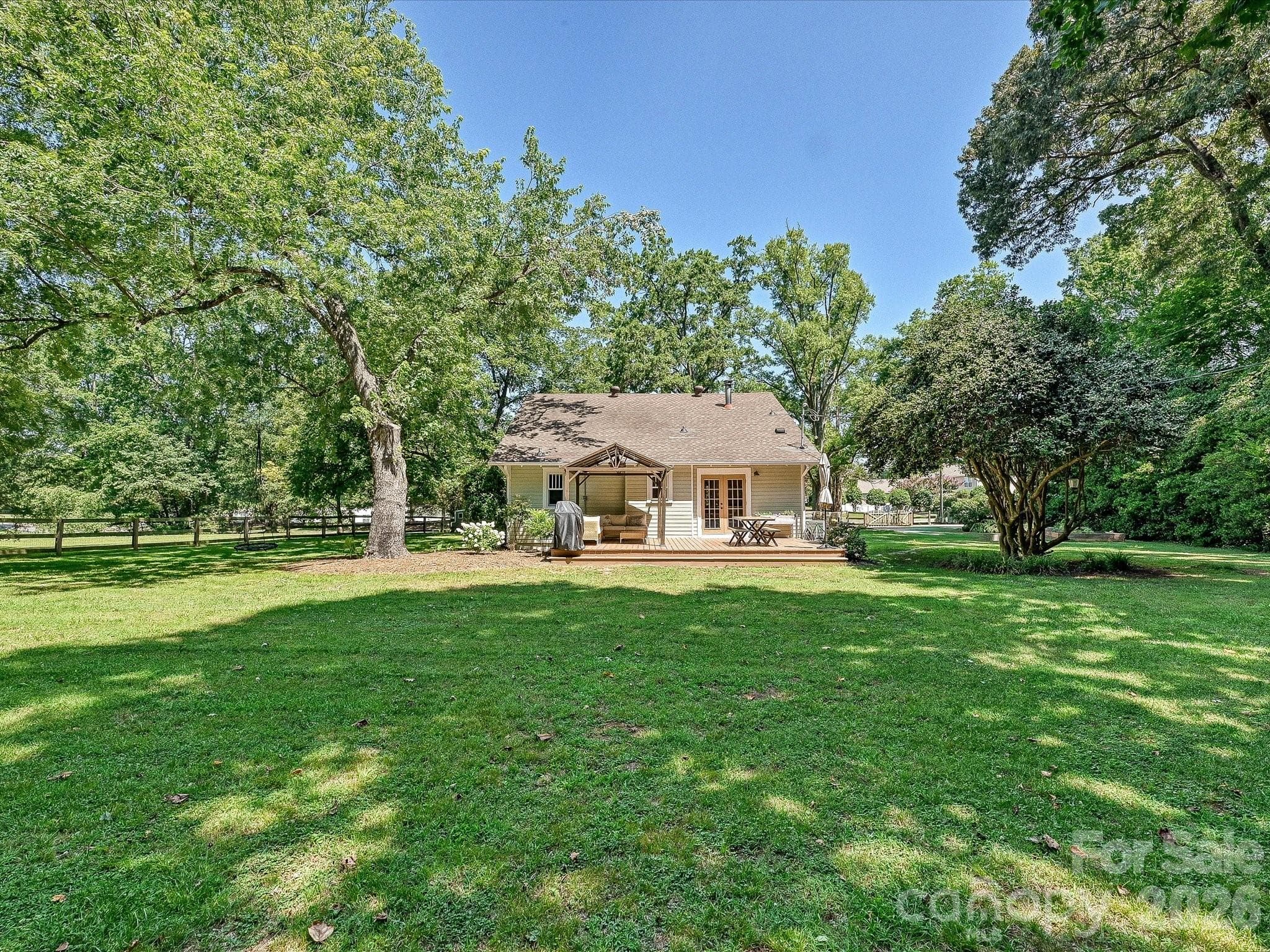 Enjoy peaceful outdoor living with a spacious deck overlooking the private backyard, perfect for gatherings or quiet evenings at home. - 3514 Kelly Road, Charlotte