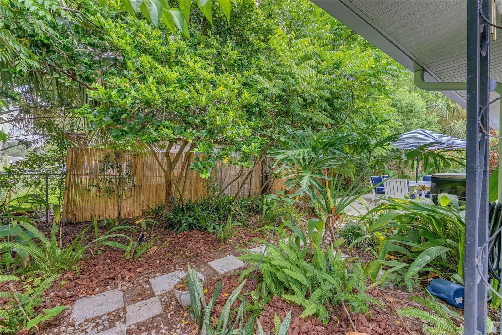 Walkway from front porch to side patio. - 5704 13TH ST, ZEPHYRHILLS