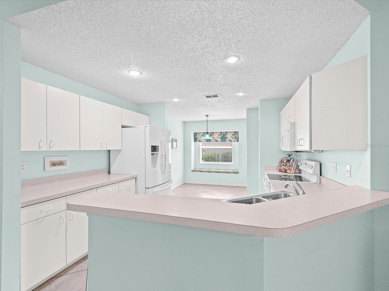 Kitchen with Breakfast Bar - 830 MCCALLISTER AVE, SUN CITY CENTER