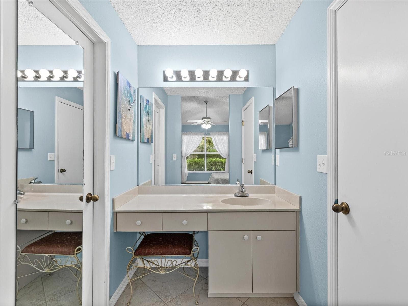 Vanity area of Primary Bathroom. Large walkin closet on left - 830 MCCALLISTER AVE, SUN CITY CENTER