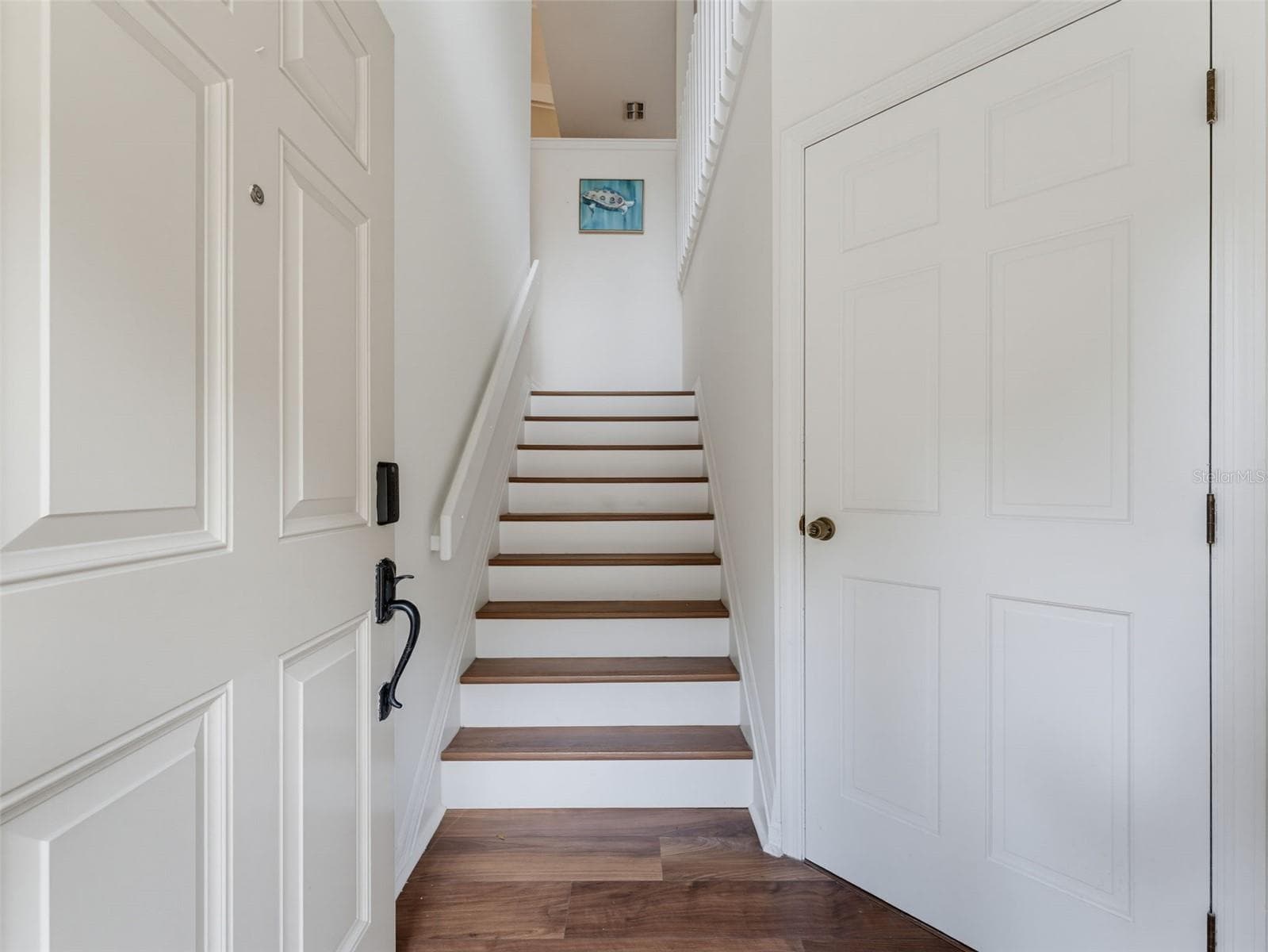 Foyer leading to living area and garage - 1491 MAHOGANY LN #1491, PALM HARBOR