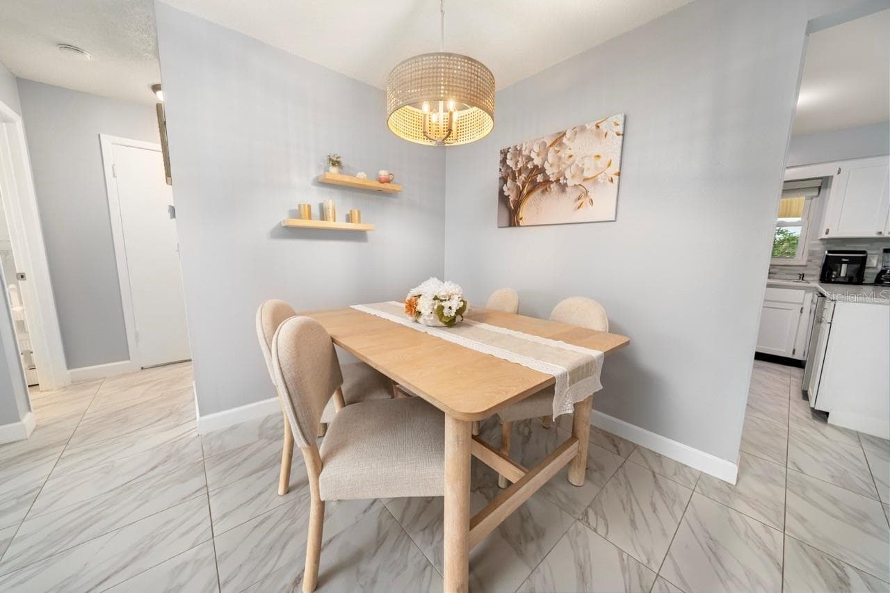 DINING ROOM, LOOK AT THIS LIGHTING - 8235 BURGUNDY DR N #3, PINELLAS PARK