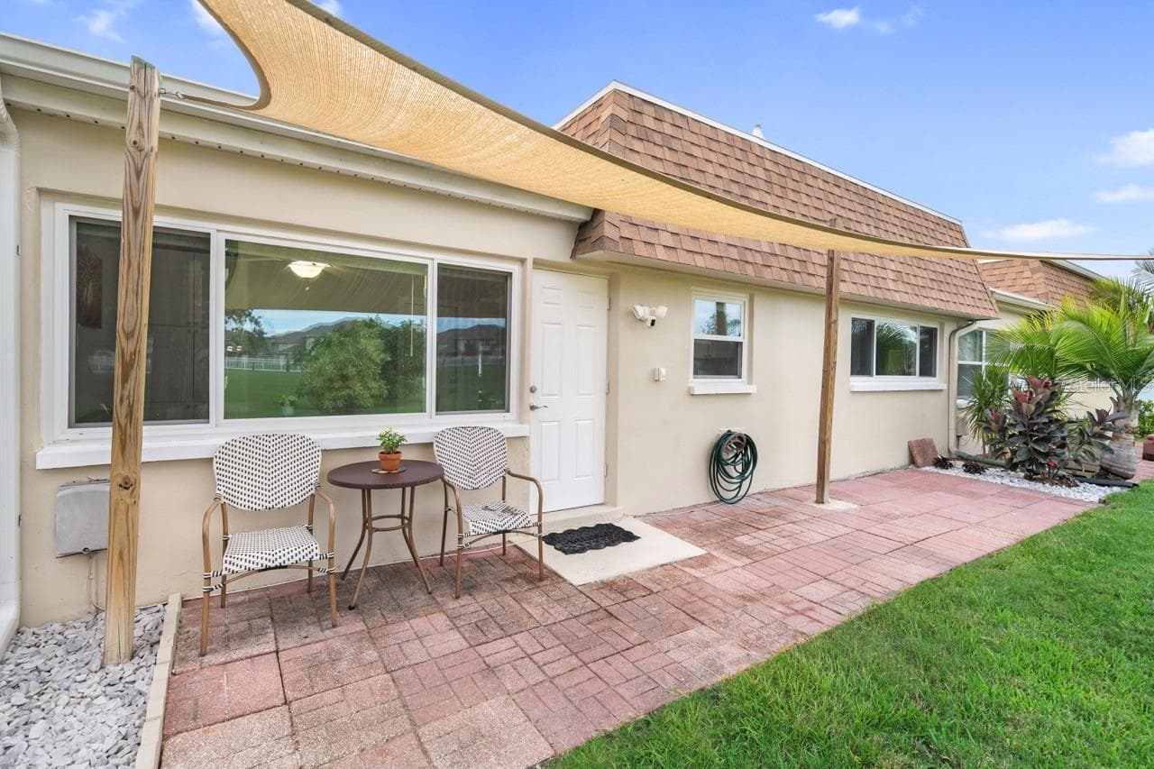 COVERED BACK PATIO & YARD. - 8235 BURGUNDY DR N #3, PINELLAS PARK