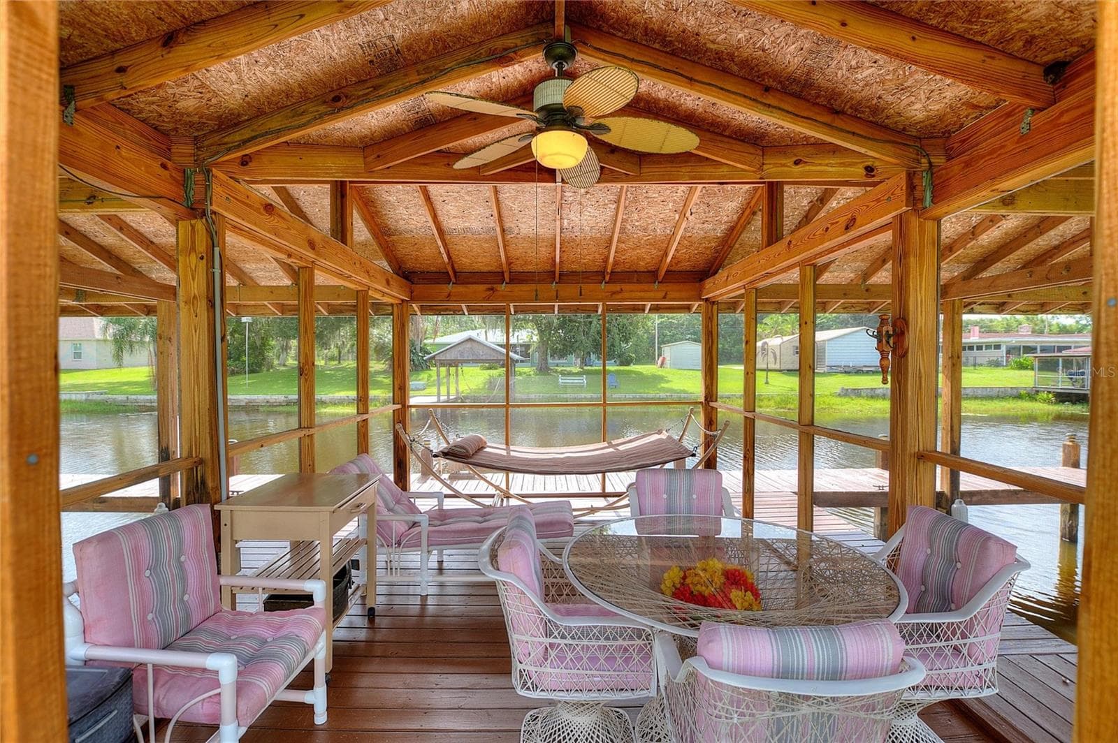 Inside of the screened room. - 6197 AMARYLLIS DR, INDIAN LAKE ESTATES