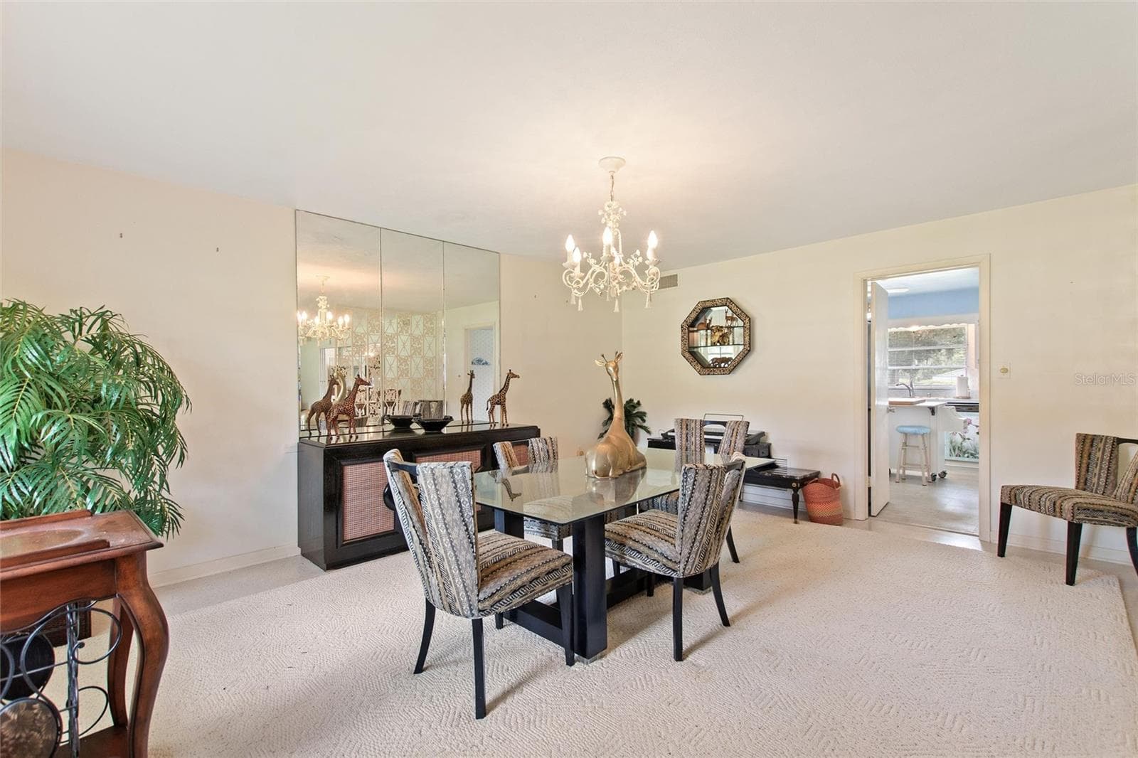 Formal dining room. The door in the back leads into the kitchen. - 6197 AMARYLLIS DR, INDIAN LAKE ESTATES