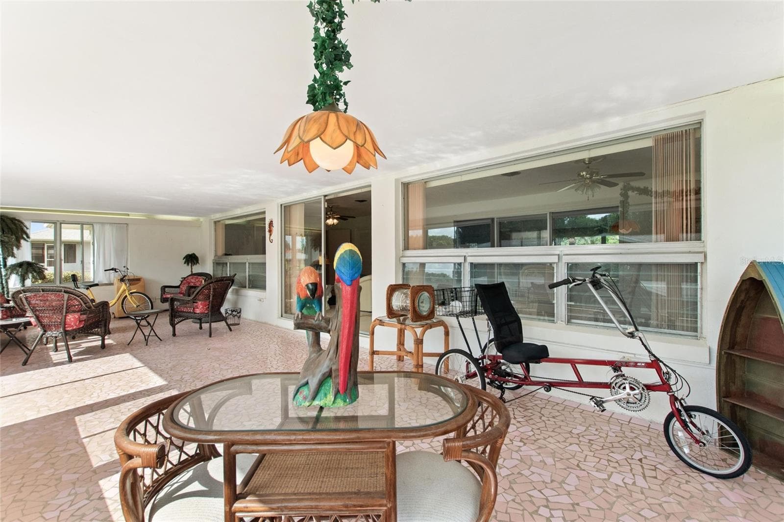 Reverse view of sun room looking back to entry to family room area. - 6197 AMARYLLIS DR, INDIAN LAKE ESTATES