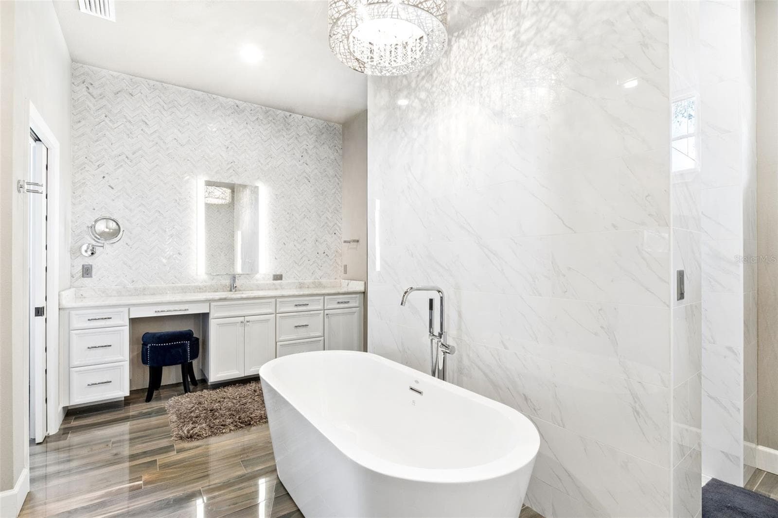 Marble Walls and Ceiling to Counter glass tiled backspace, backglowing mirrors and attached hanging magnifying mirror. - 1629 HEMPEL AVE, WINDERMERE