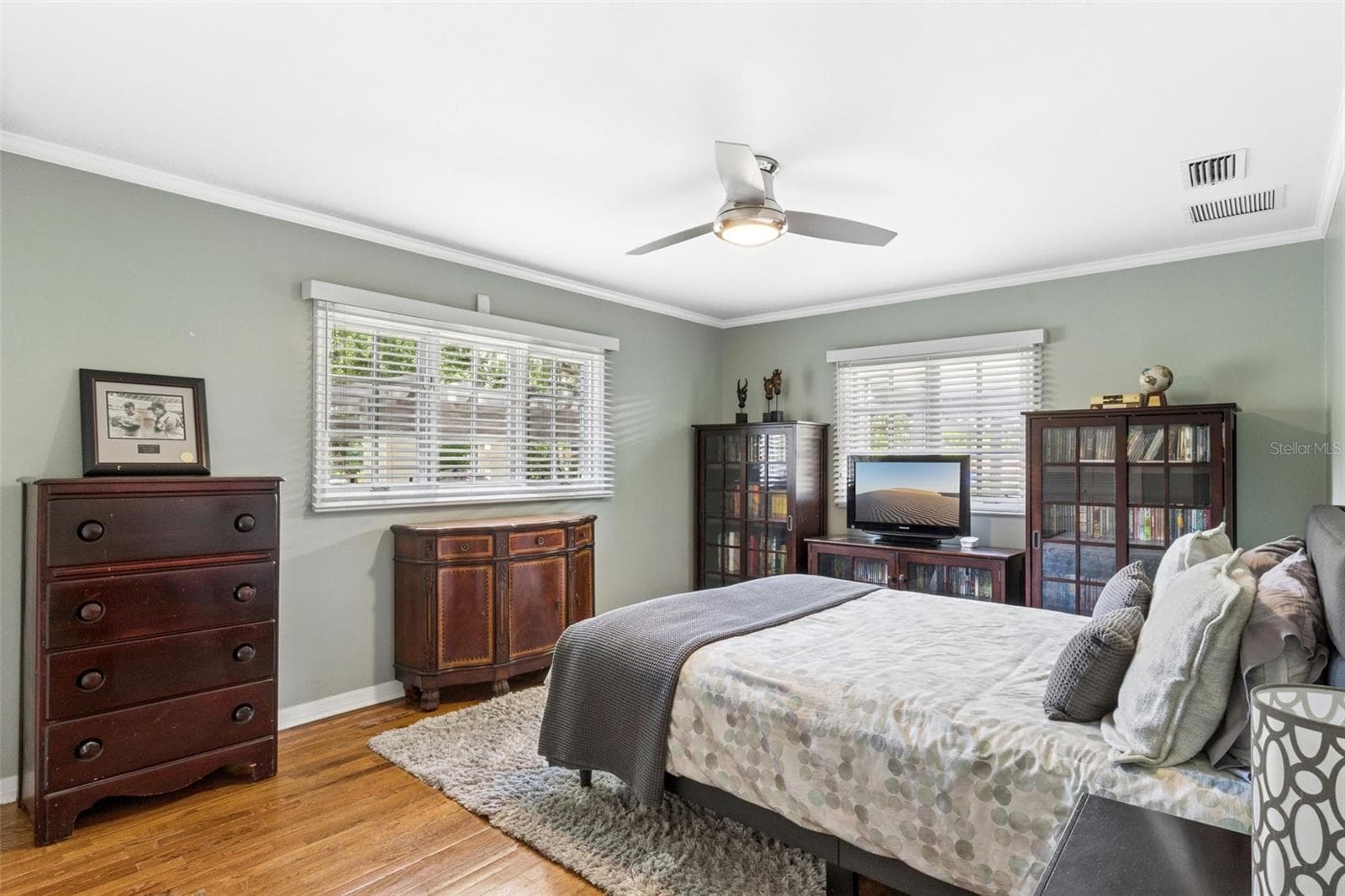 Bedroom #3 featuring customed closet and natural wood floors. - 1629 HEMPEL AVE, WINDERMERE
