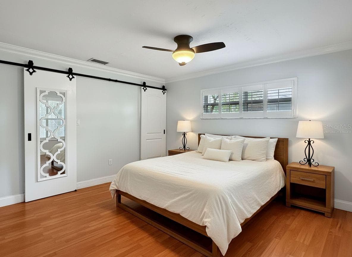 Primary Bedroom - Virtually Staged - 1011 WINDING OAKS DR, PALM HARBOR