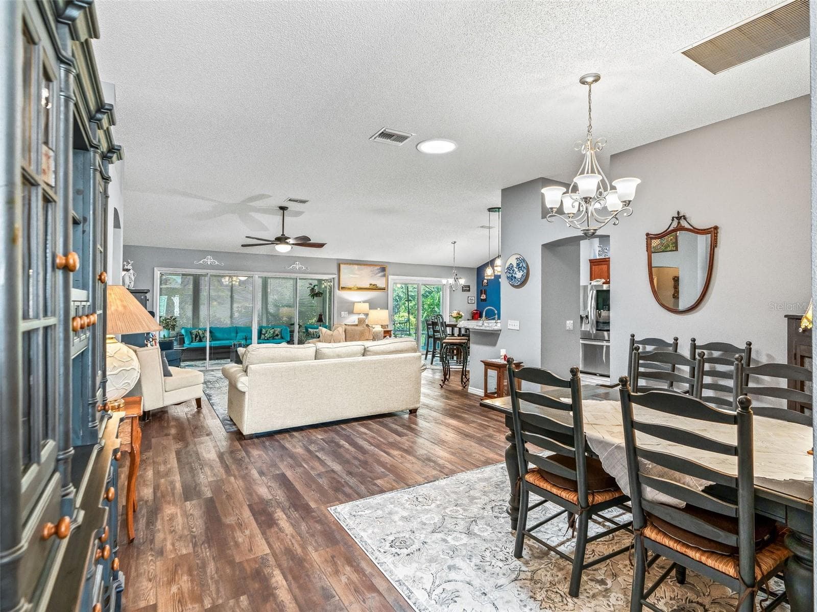 Spacious open-concept layout connects the dining area, kitchen, and living room for easy everyday living and entertaining - 17946 SE 87TH MELROSE CT, THE VILLAGES