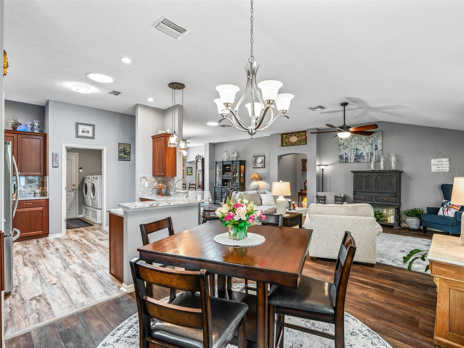 The centrally located dining area offers an easy flow to the kitchen and living room, creating a comfortable setting for meals and entertaining. - 17946 SE 87TH MELROSE CT, THE VILLAGES