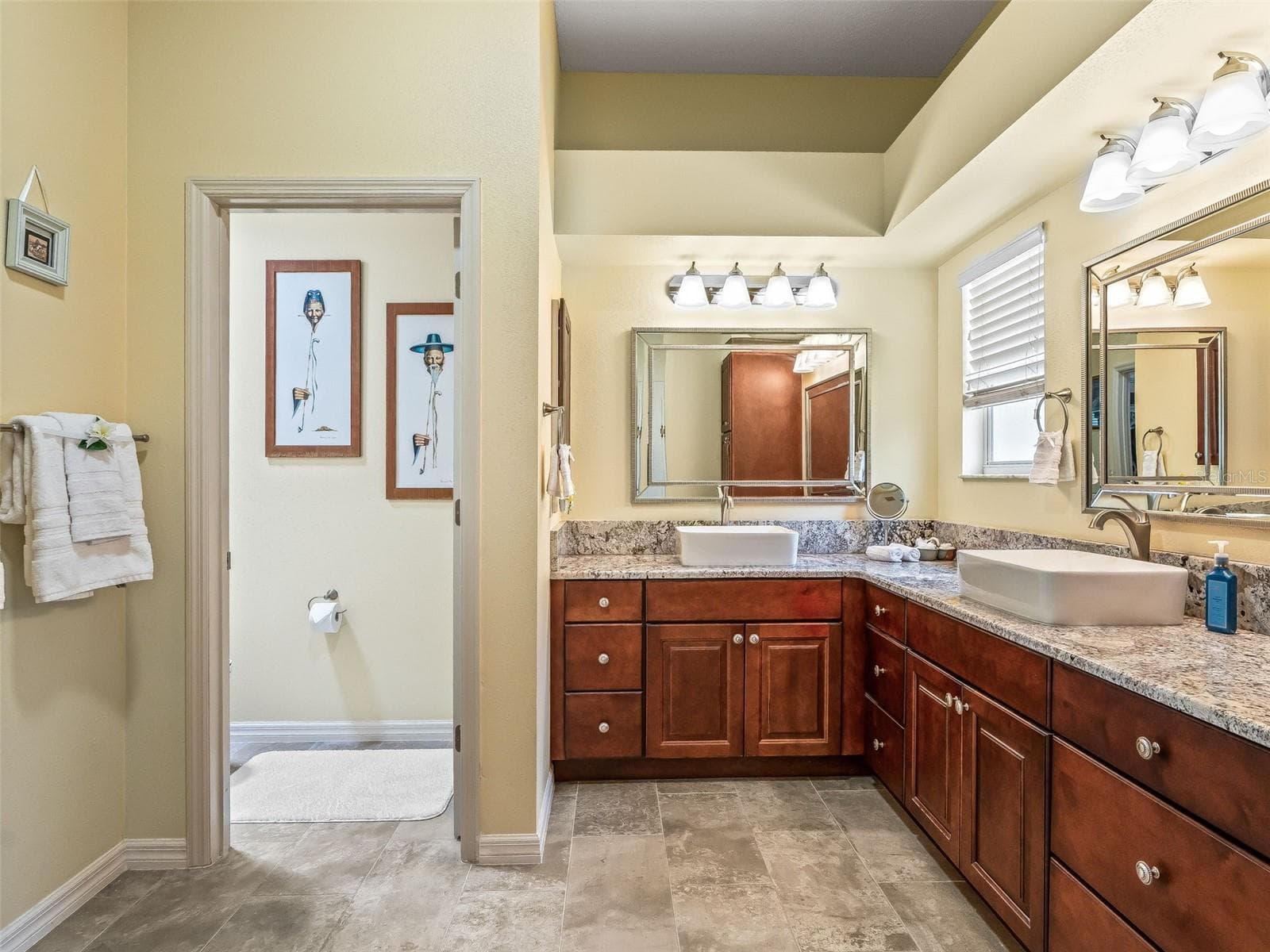 A spacious vanity layout with ample storage and counter space creates a functional and comfortable setting for daily routines. - 17946 SE 87TH MELROSE CT, THE VILLAGES