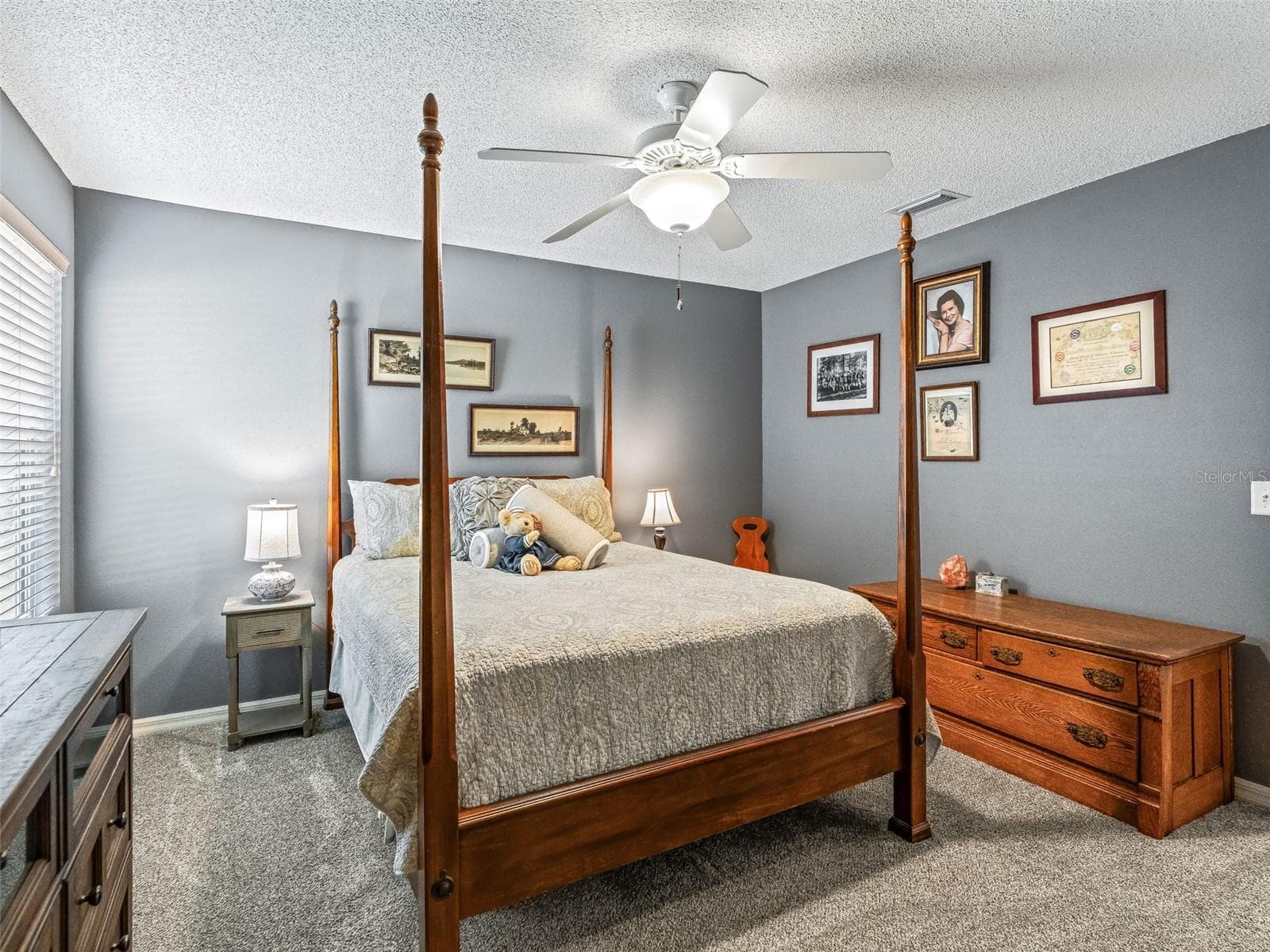 The spacious secondary bedroom with closet, provides room for a full furniture arrangement, along with a ceiling fan, and ample natural light. - 17946 SE 87TH MELROSE CT, THE VILLAGES