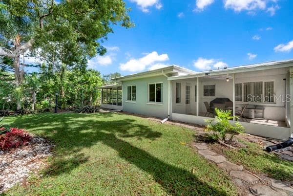 BACK OF HOUSE WITH YARD - 133 STAFFORD CIR, PALM HARBOR