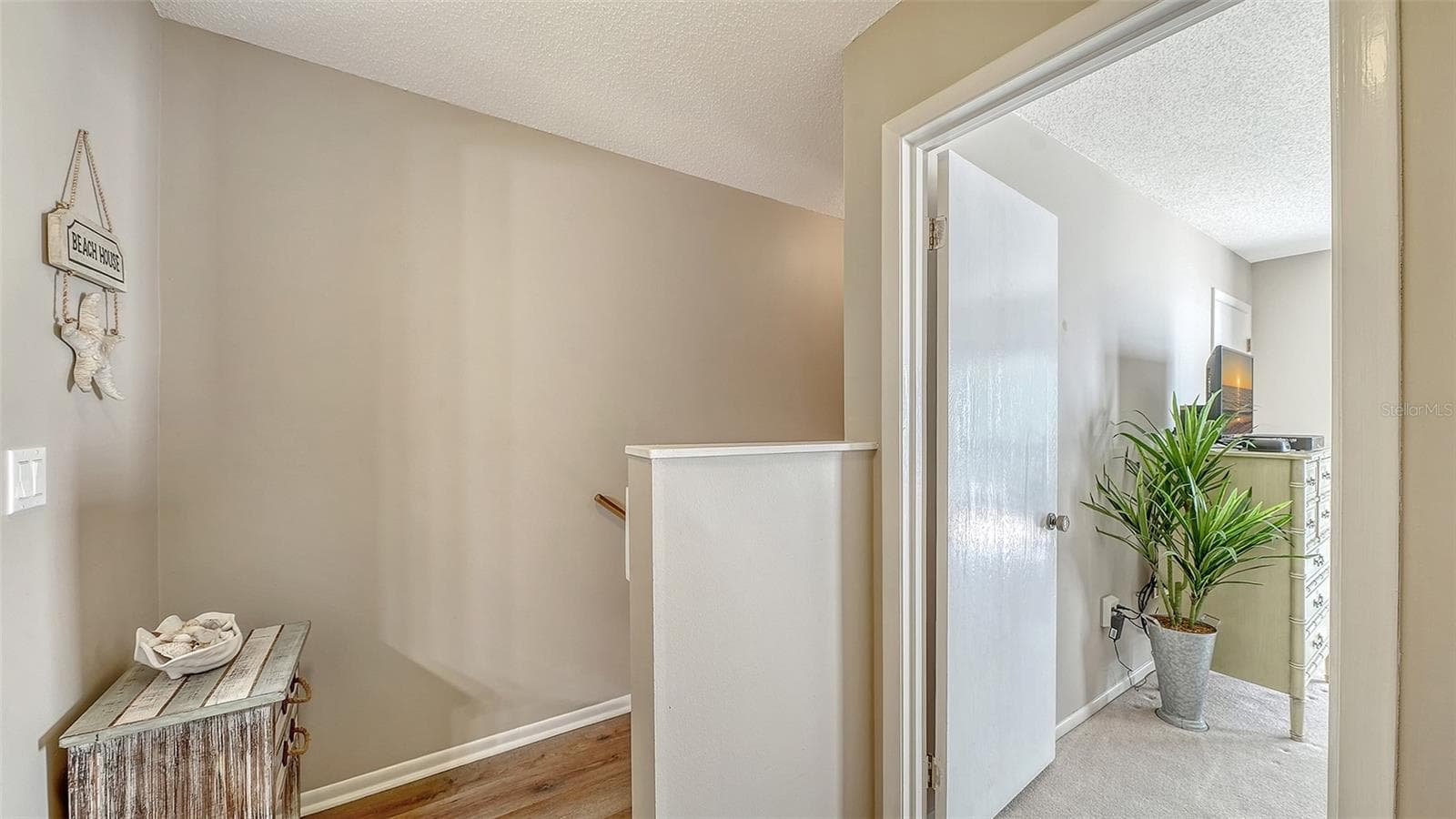 Landing at the top of the stairway on the second floor. - 1646 STICKNEY POINT RD #101, SARASOTA