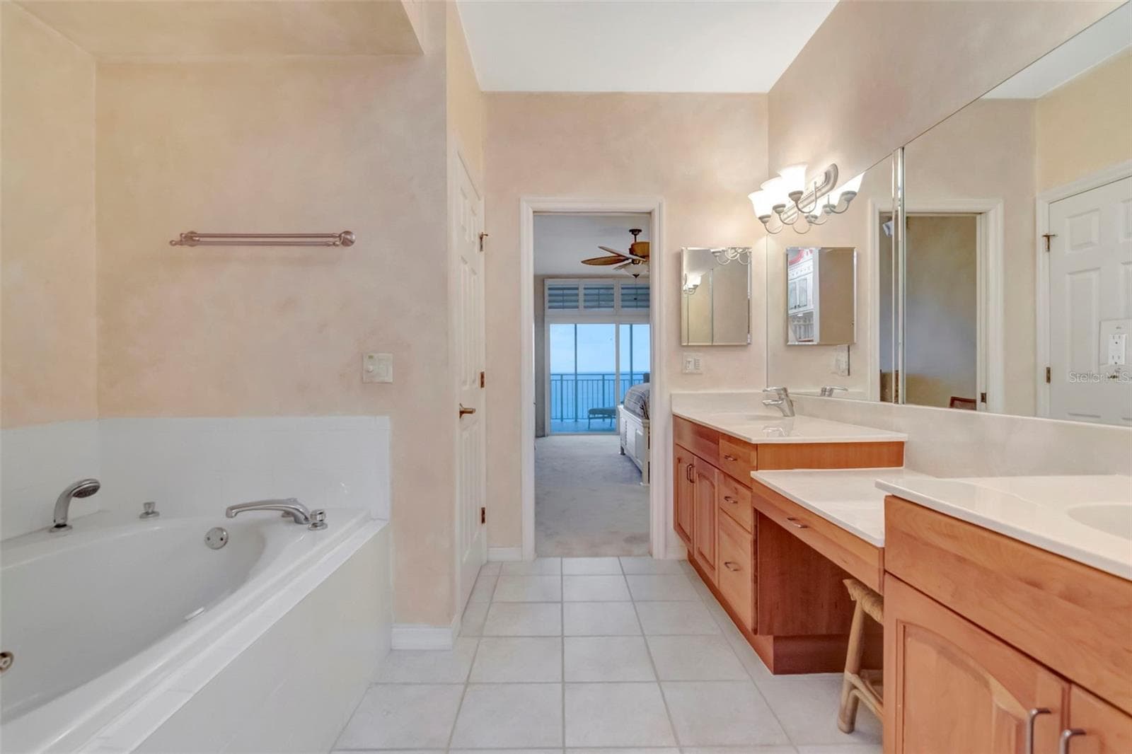 Primary bedroom ensuite with double vanity sinks, whirlpool bath, separate shower and toilet. - 2 15TH AVE #303, INDIAN ROCKS BEACH