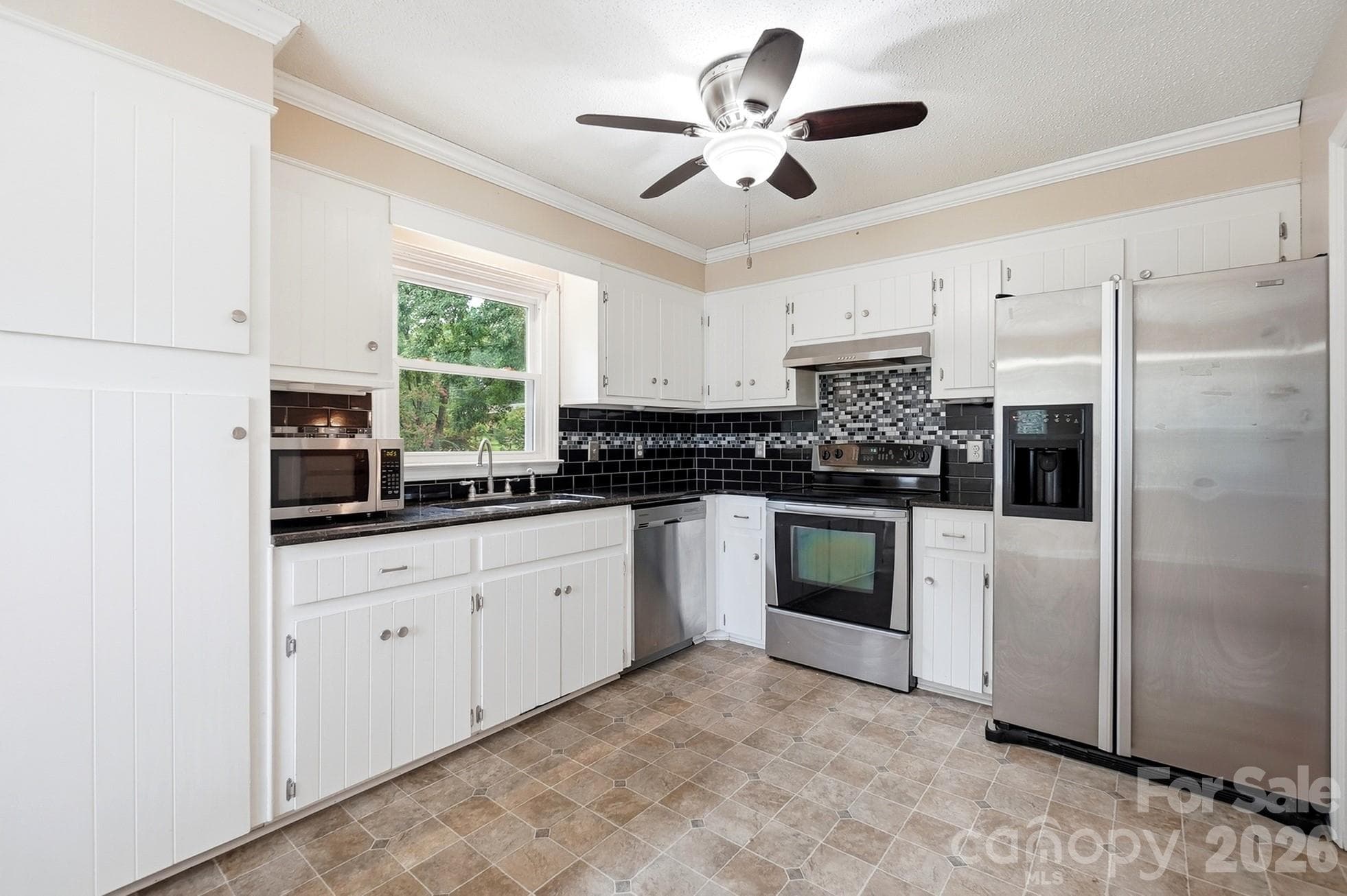Modern kitchen with white cabinetry - 2600 Providence Drive, Gastonia