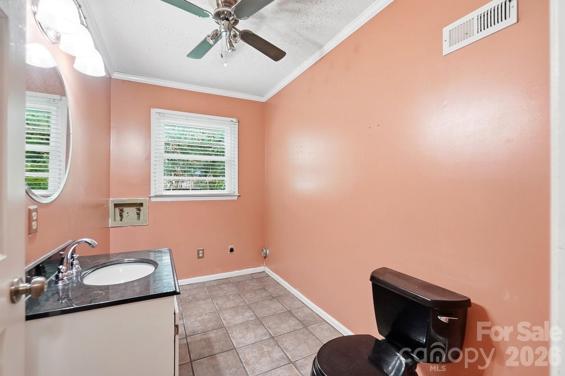 Laundry room and half bath in the basement - 2600 Providence Drive, Gastonia
