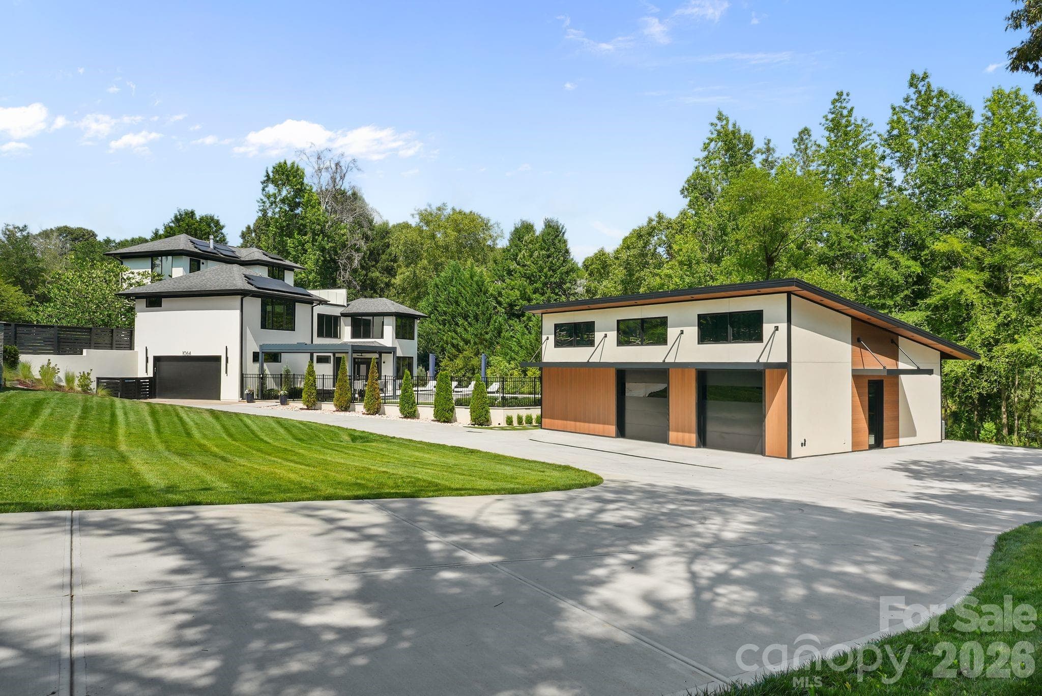 Custom rear-entry garage with oversized circular driveway and gated entry - 1064 Greylyn Drive, Matthews