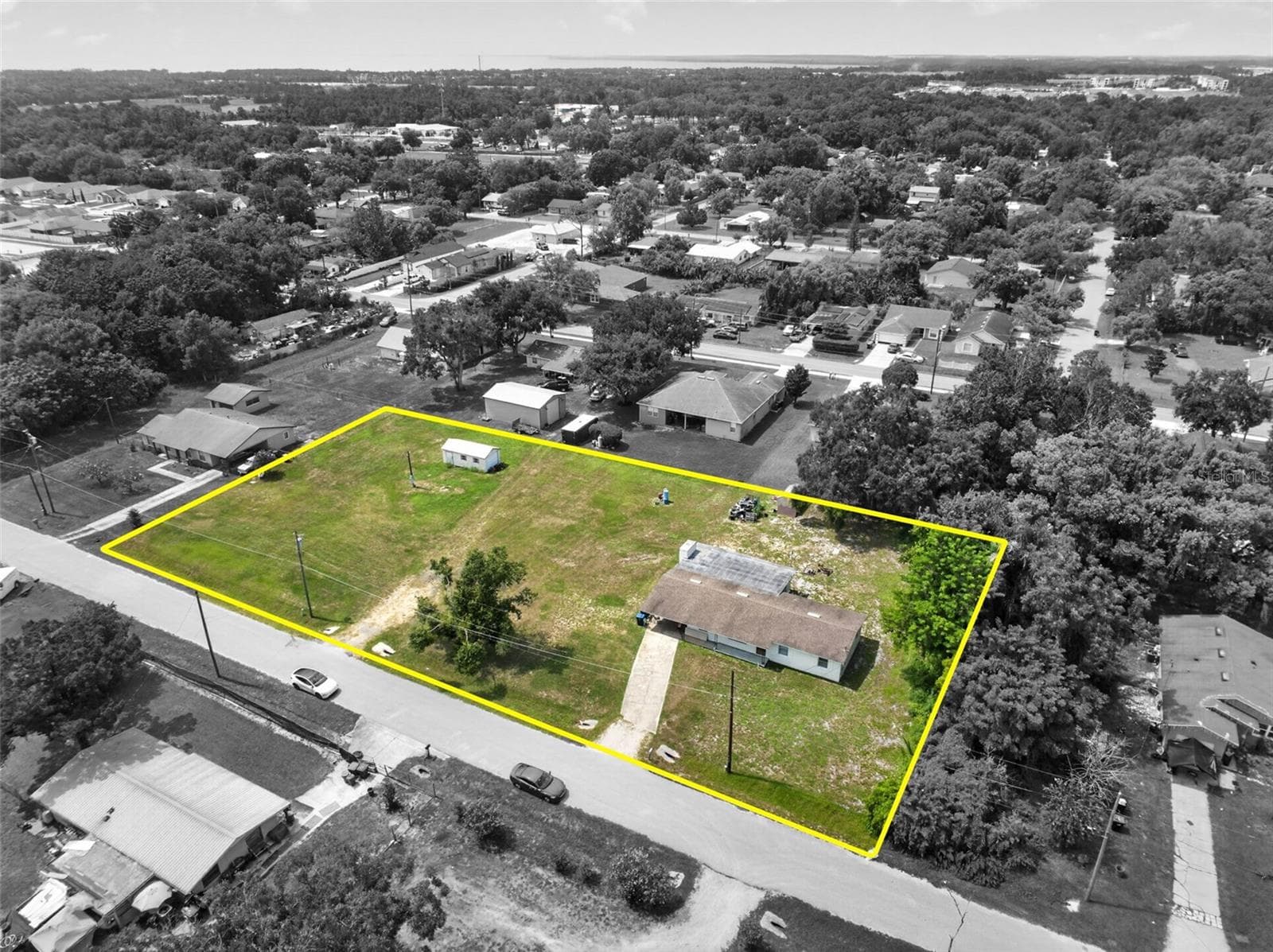 Aerial spotlight view of the parcel boundary. - 212 15TH AVE, OCOEE