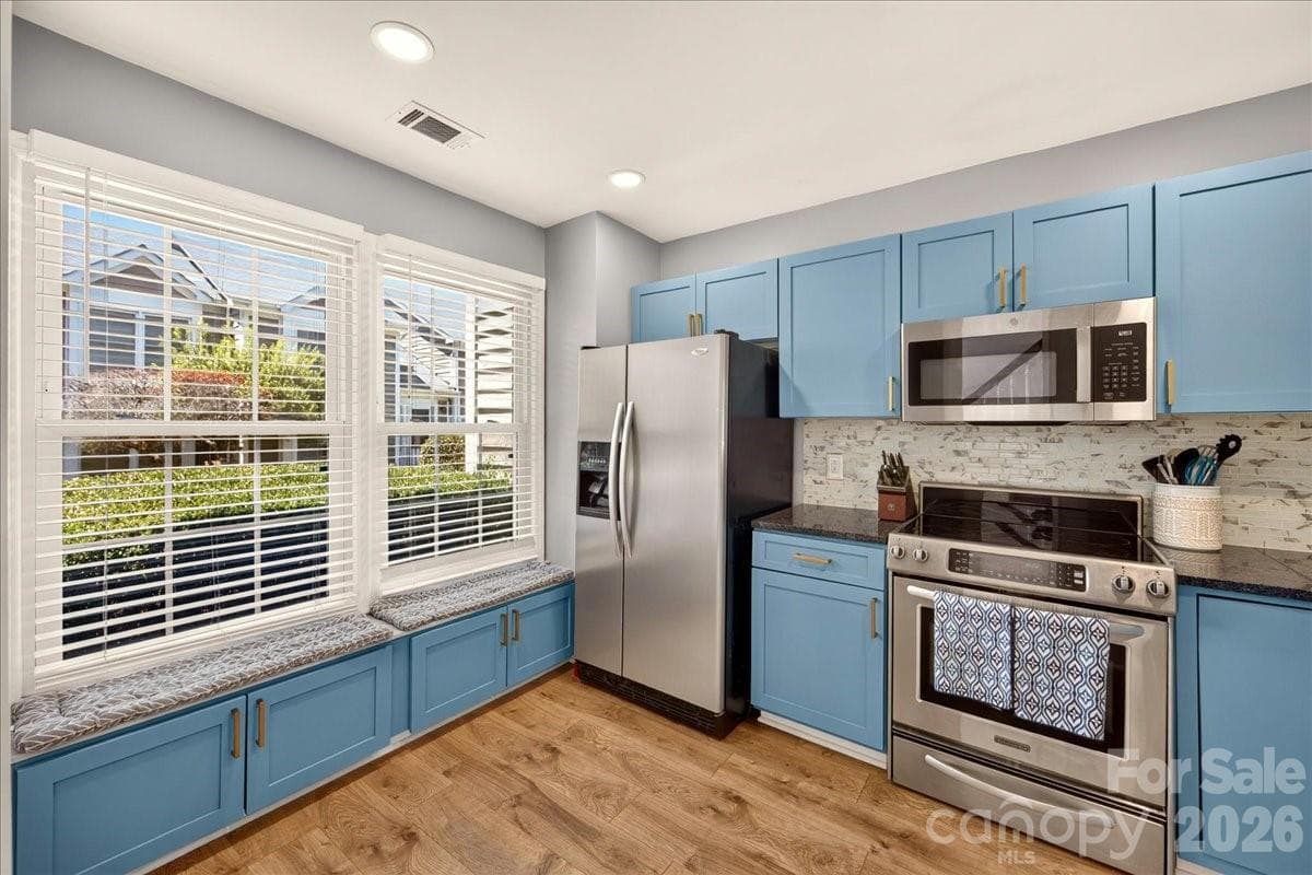 Bench seating and storage in the kitchen - 8220 Legare Court, Charlotte