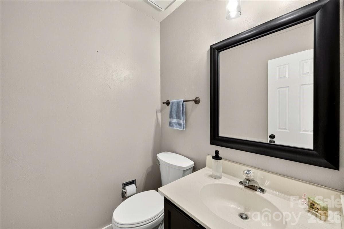 Powder bathroom on the main level - 8220 Legare Court, Charlotte