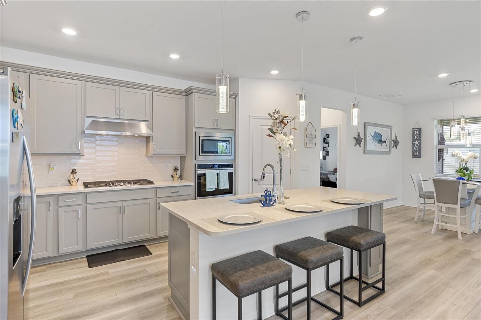 Beautiful back splash, Blue tooth oven, gas range with primary suite in back. - 3009 61ST DR E, ELLENTON