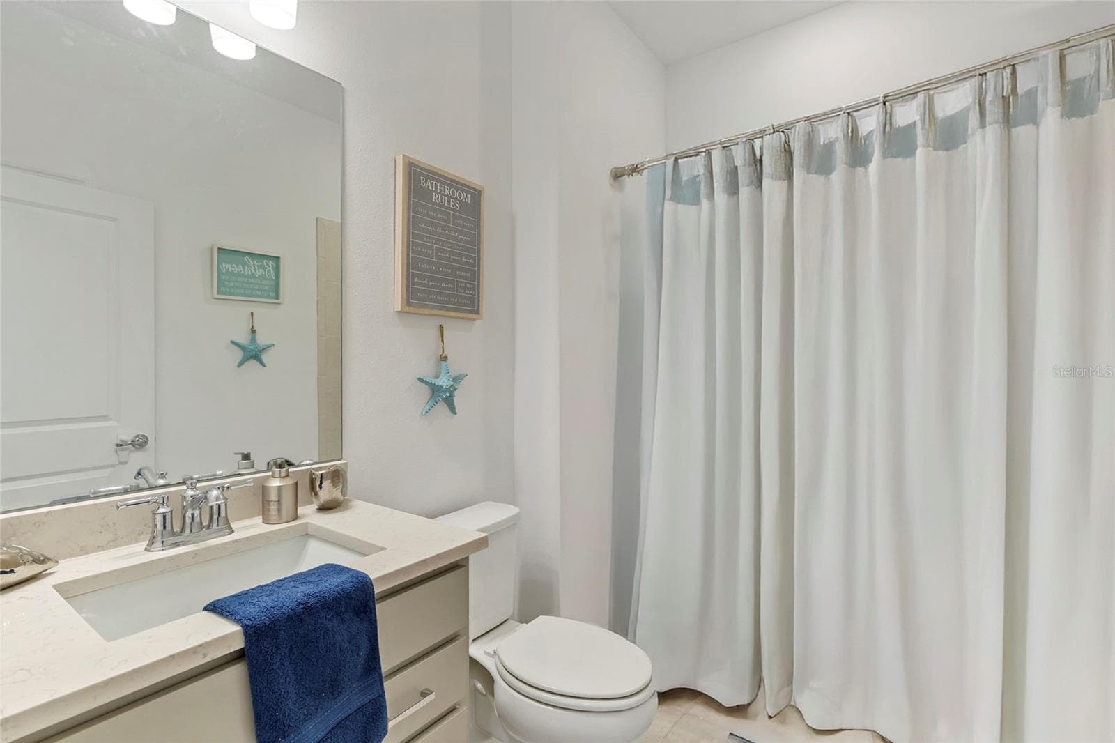 bath in front of home nestled between two bedrooms - 3009 61ST DR E, ELLENTON