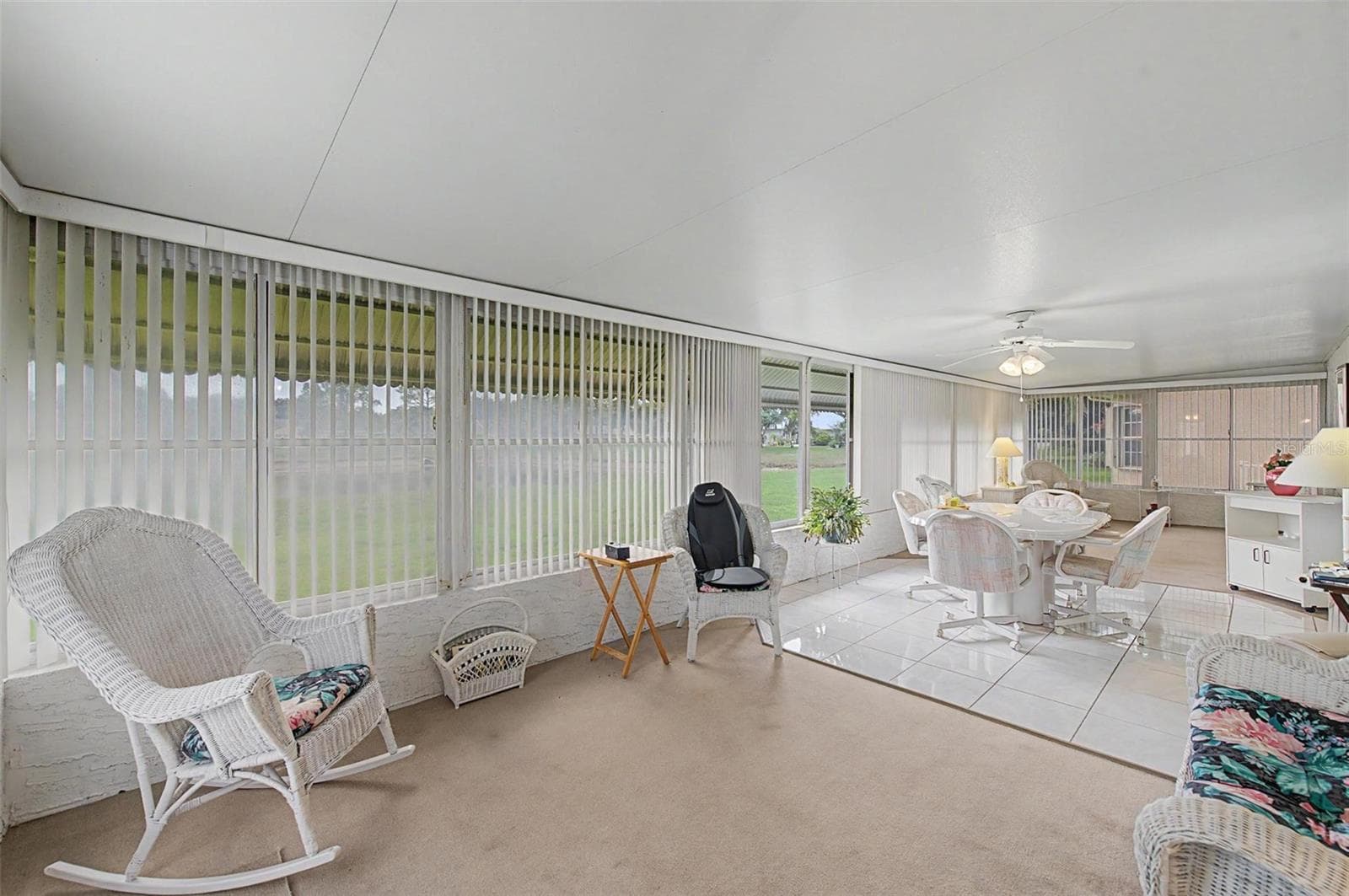 Enclosed Florida Room looks out at pond. - 4709 PORTLAND MANOR DR, NEW PORT RICHEY