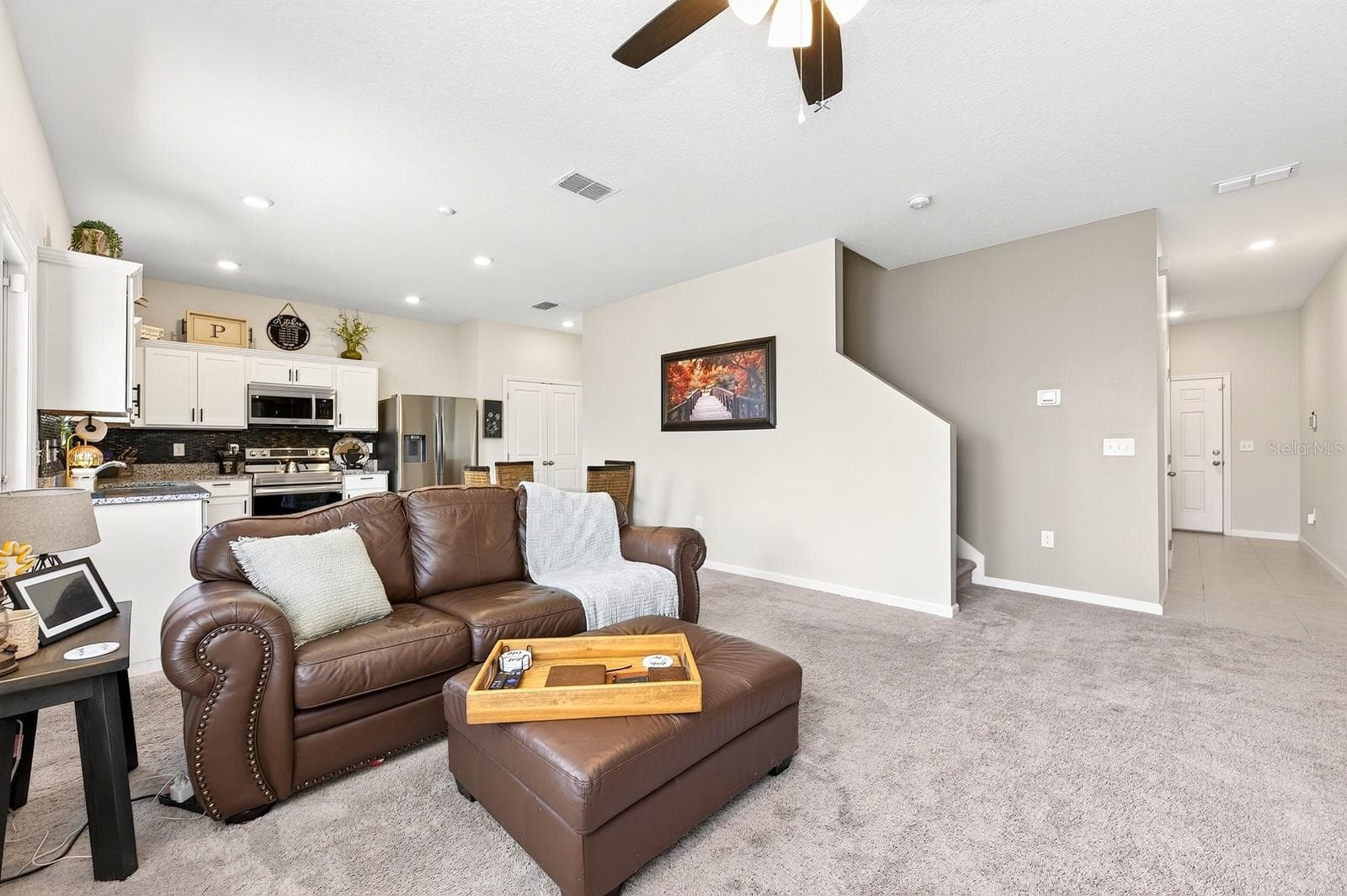 Inside, the thoughtfully designed OPEN-CONCEPT FLOOR PLAN seamlessly connects the Living Room and Kitchen, making it ideal for both everyday living and entertaining. - 1961 HEMINGWAY CIR, GROVELAND
