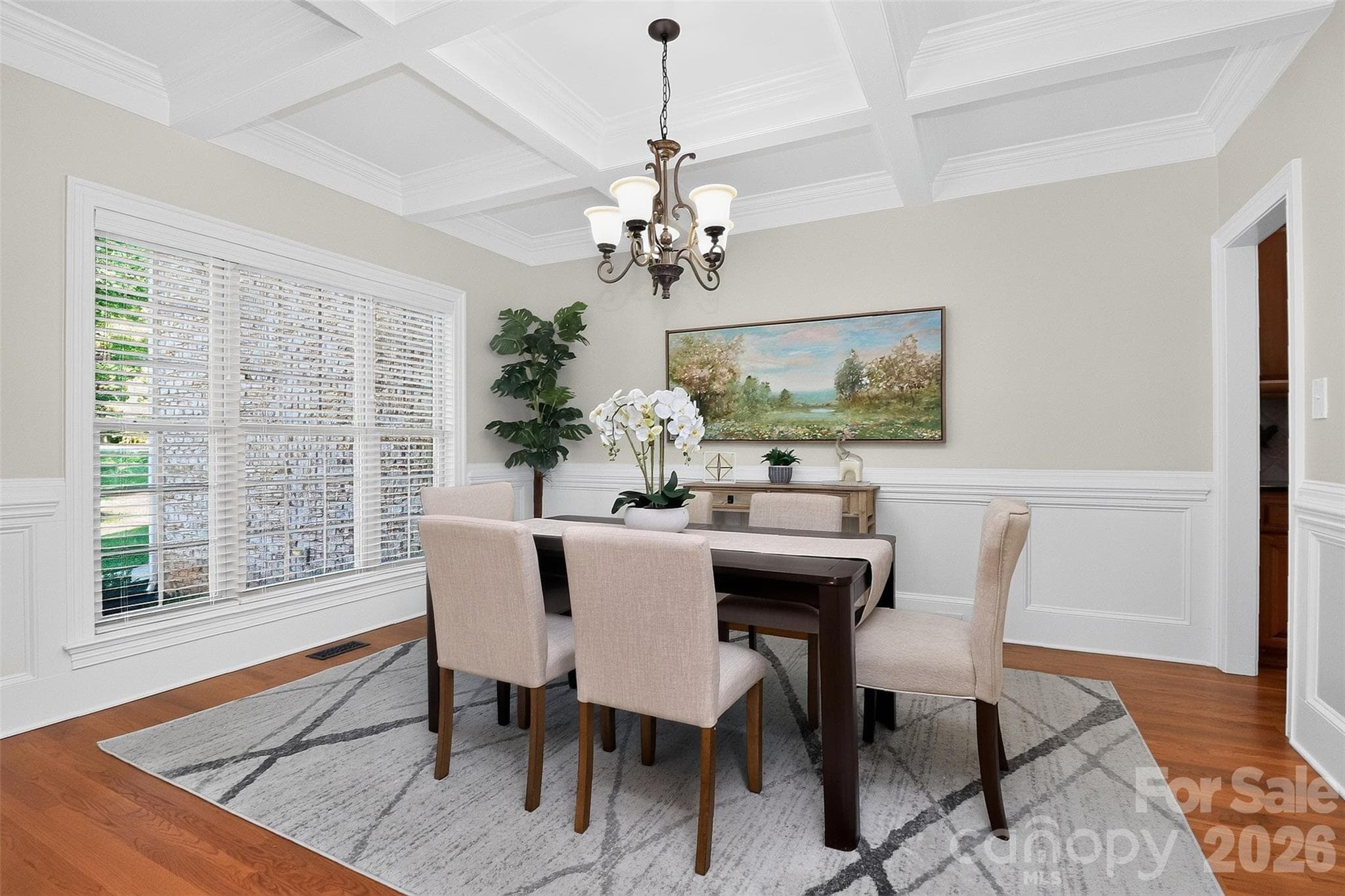 Formal dining room with coffered ceilings and wainscoting. - 4817 Pimlico Lane, Waxhaw