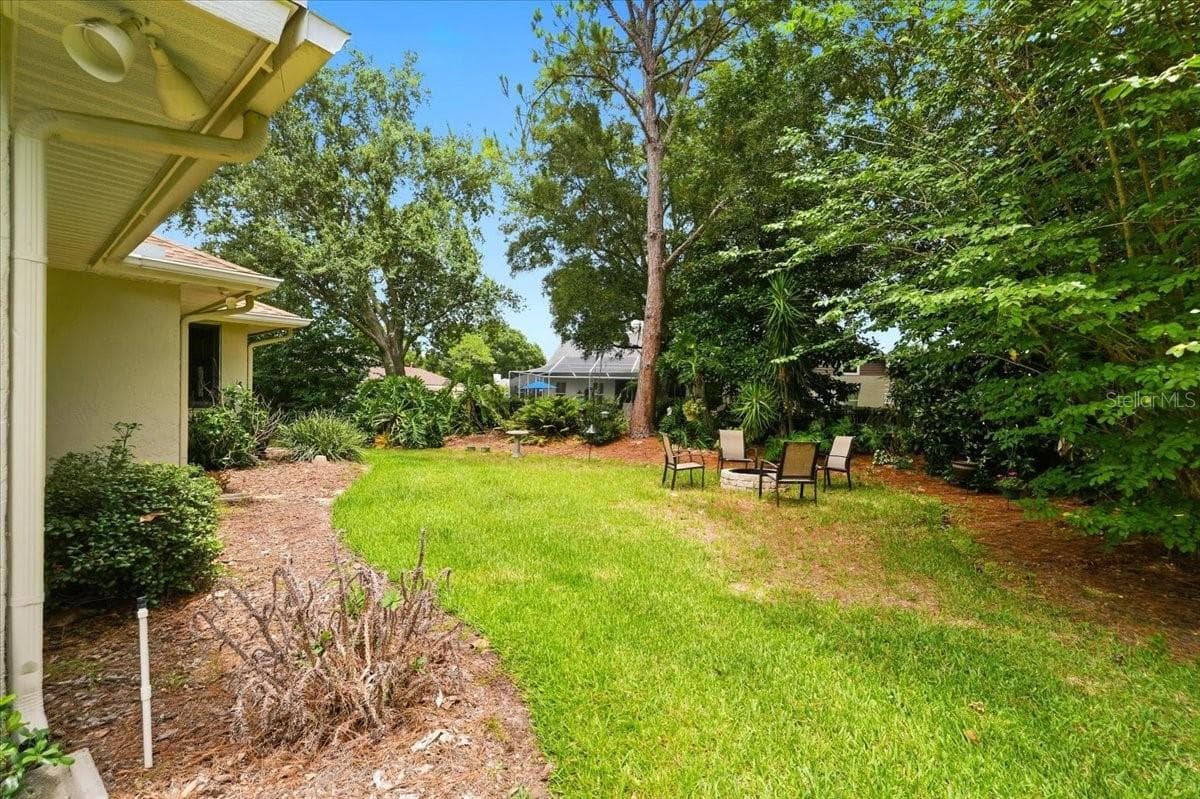 back yard view.... fire pit - 3158 BEAUCHAMP CT, WINTER HAVEN