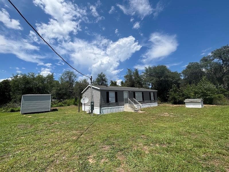Manufactured Home at 15299 NE 238TH ST, FORT MC COY, photo 2 of 31