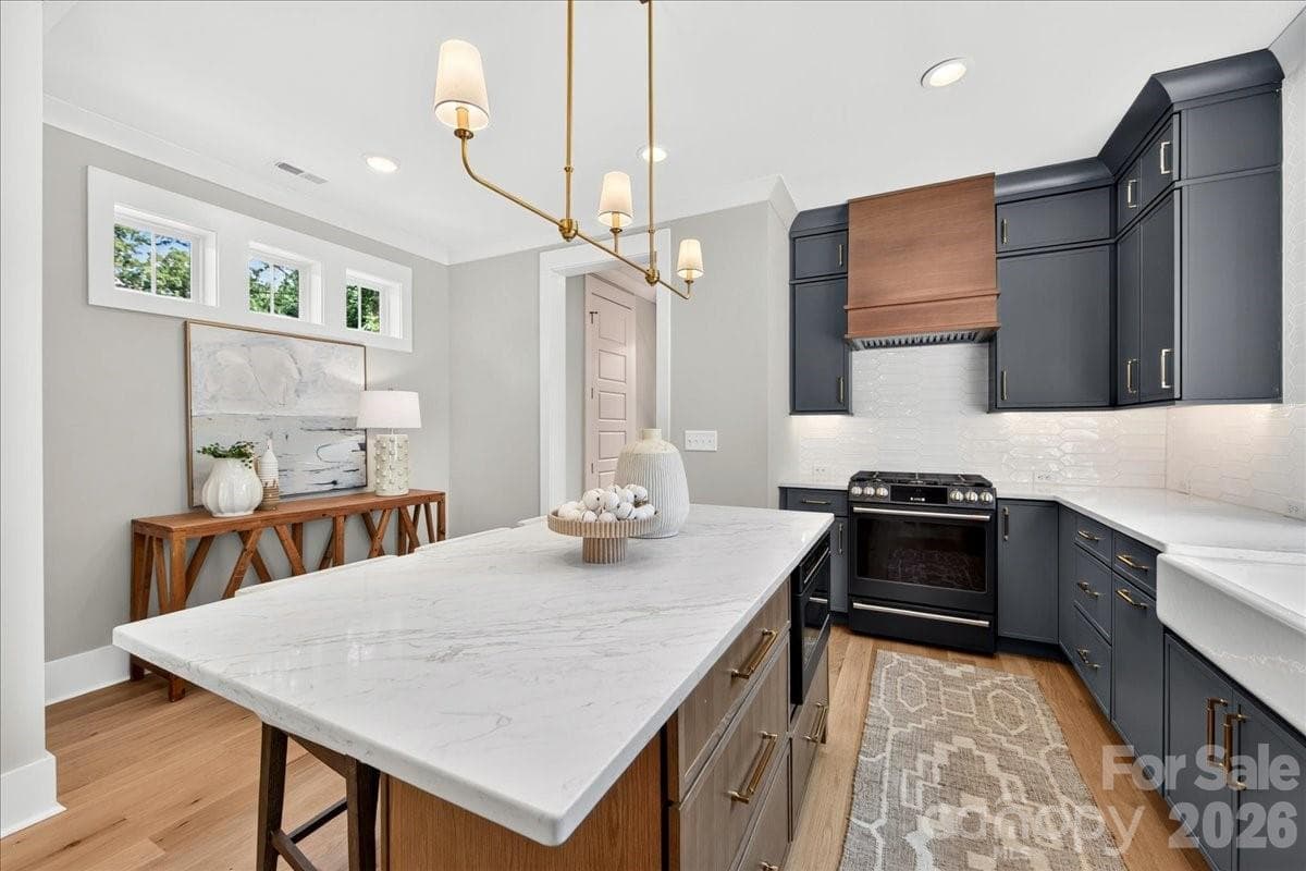 Gas range with vented hood - 3940 Admiral Avenue, Charlotte